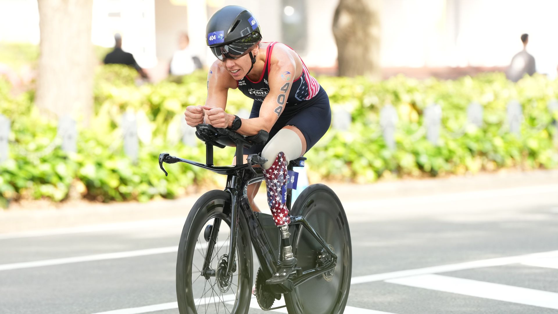 A woman rides a bike during a competition. 