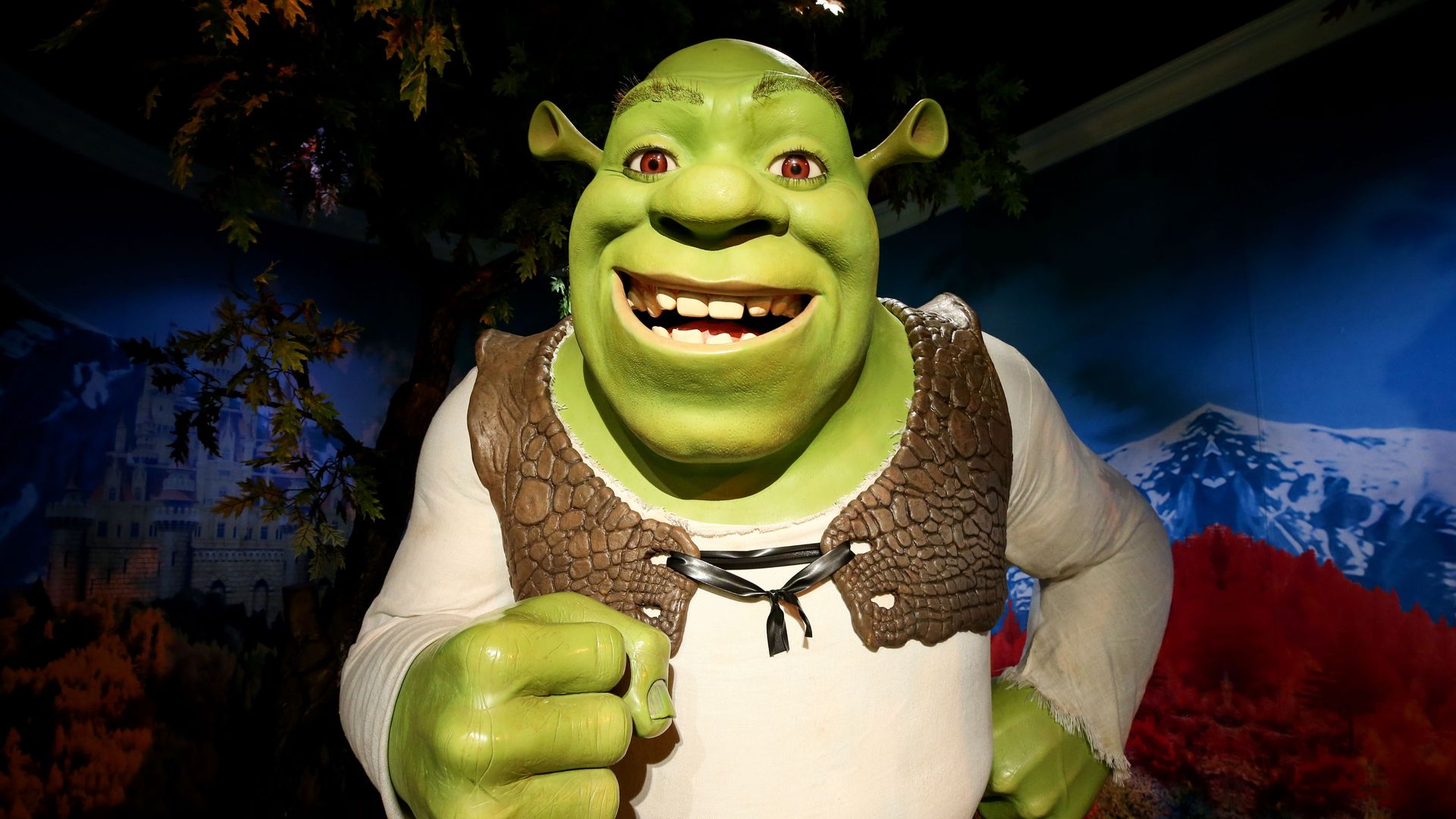 A wax sculpture of movie character Shrek .