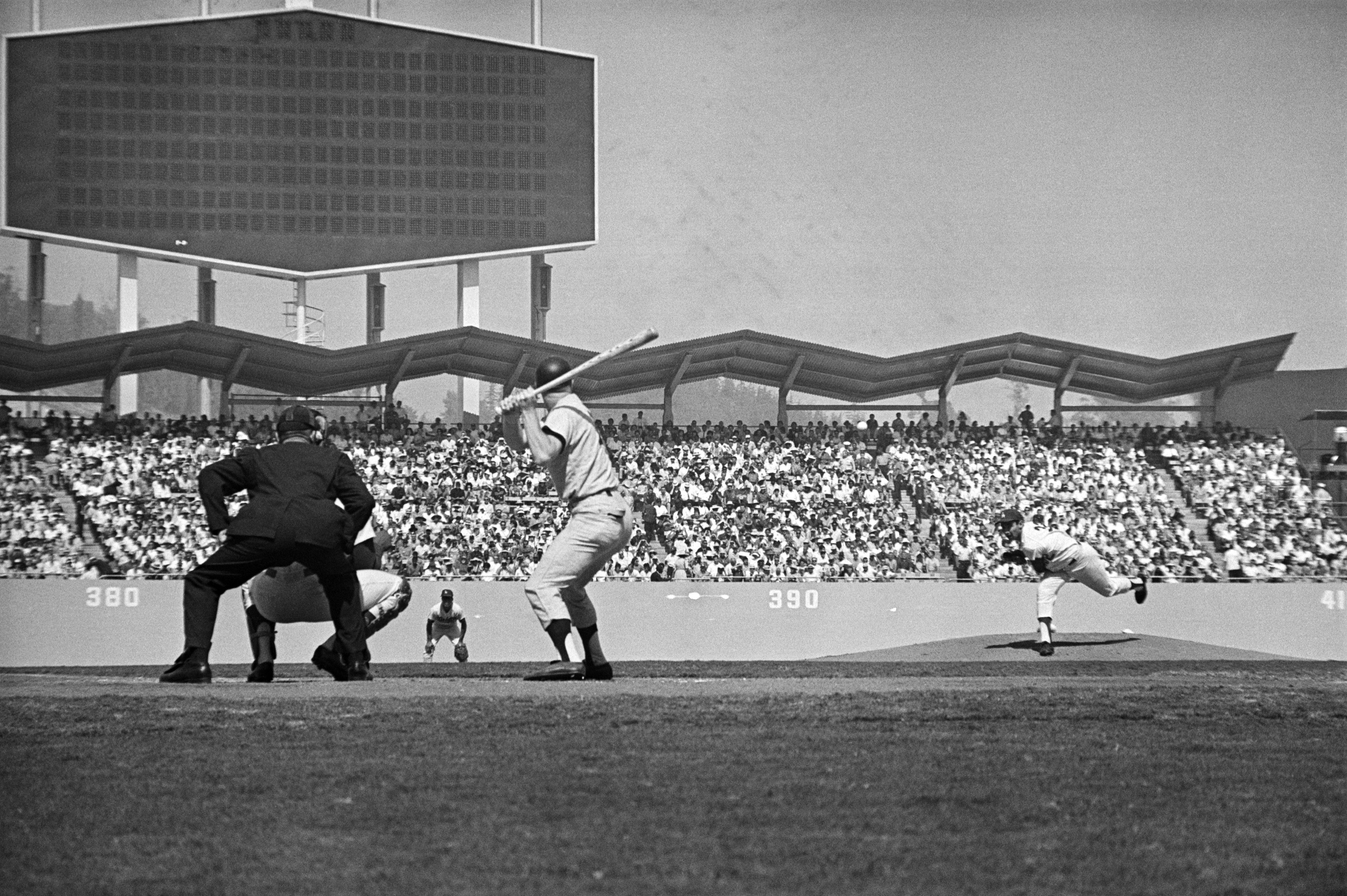 Los Angeles Dodgers' star southpaw pitcher Sandy Koufax throws the first pitch, a ball, in the Game Four of the 1963 World Series.