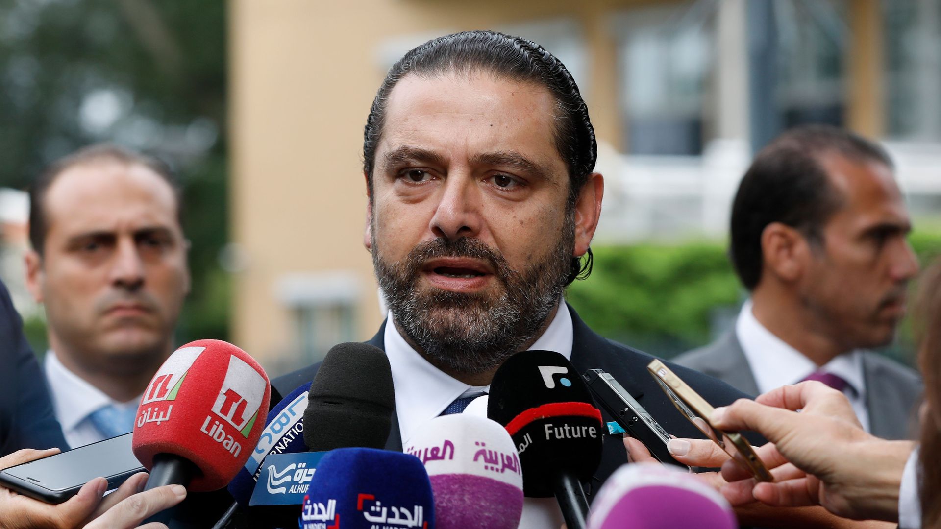 Lebanese premier-designate Saad Hariri speaks to the press in front of the Special Tribunal for Lebanon after the presentation of the closings arguments in the trial of four Hezbollah suspects 
