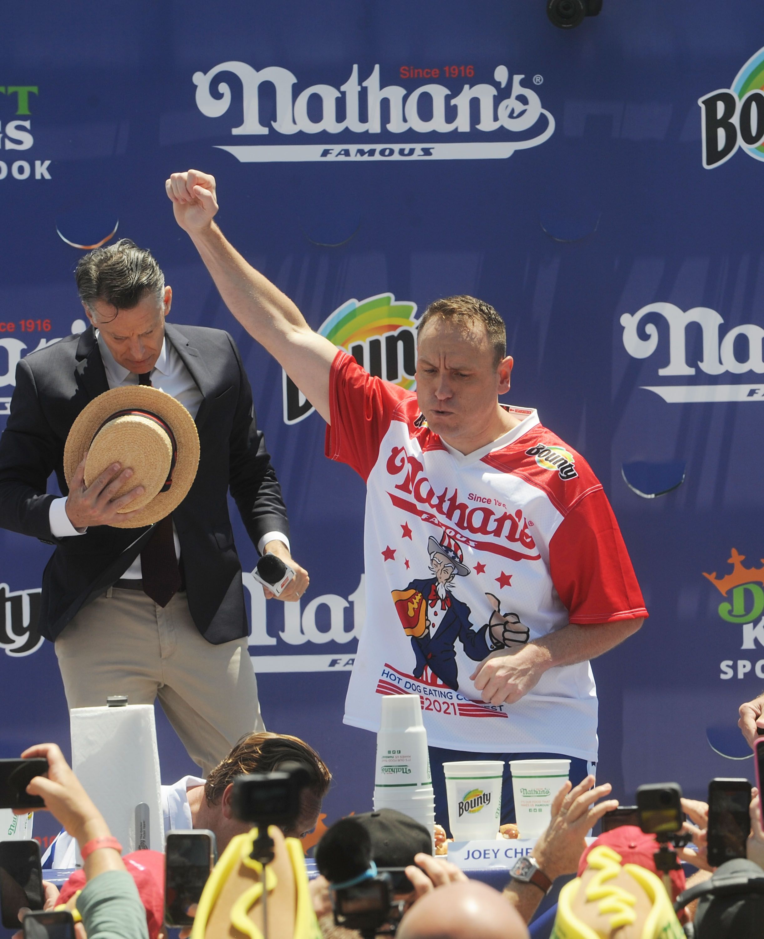 Defending Champion Joey Chestnut wins after consuming 76 hot dogs and setting a new world record at the 2021 Nathan's Famous International Hot Dog Eating Contest at Coney Island on July 4