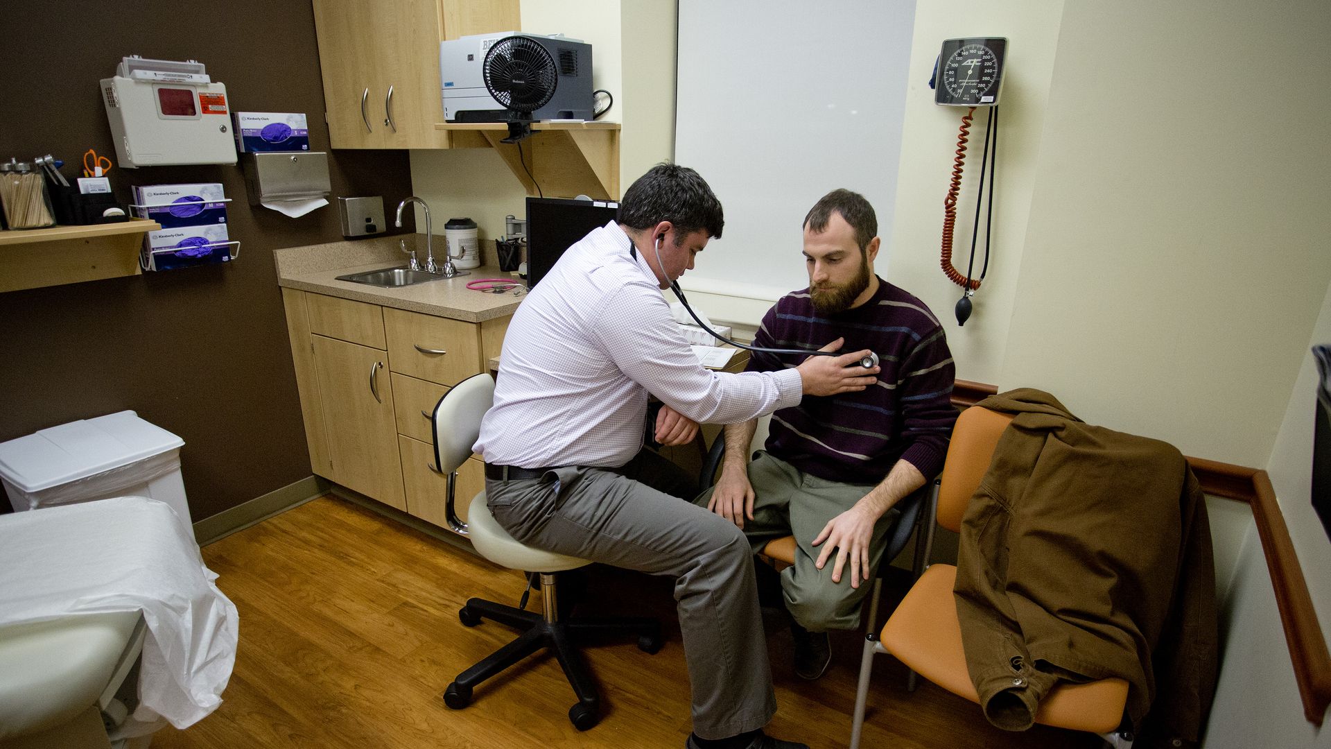 A primacy care physician and a patient.