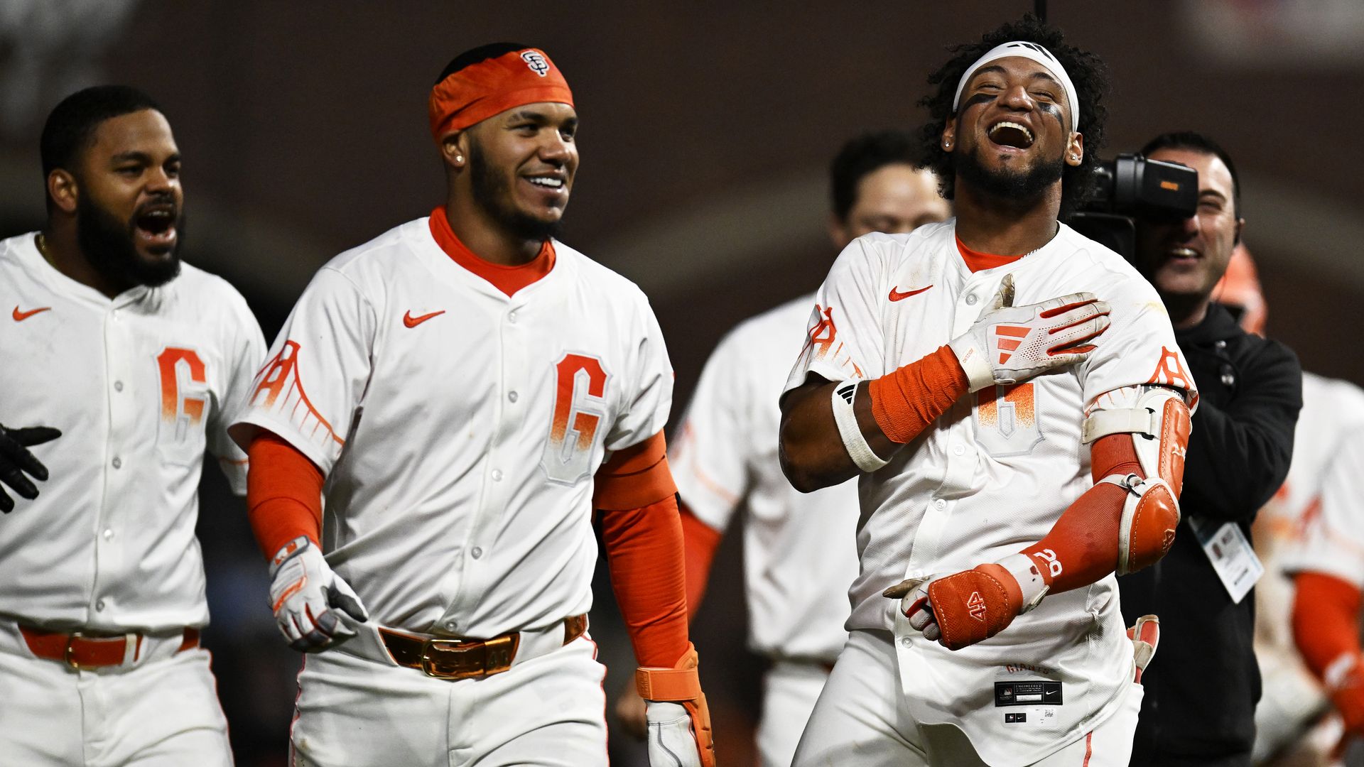 giants celebrate in white jerseys
