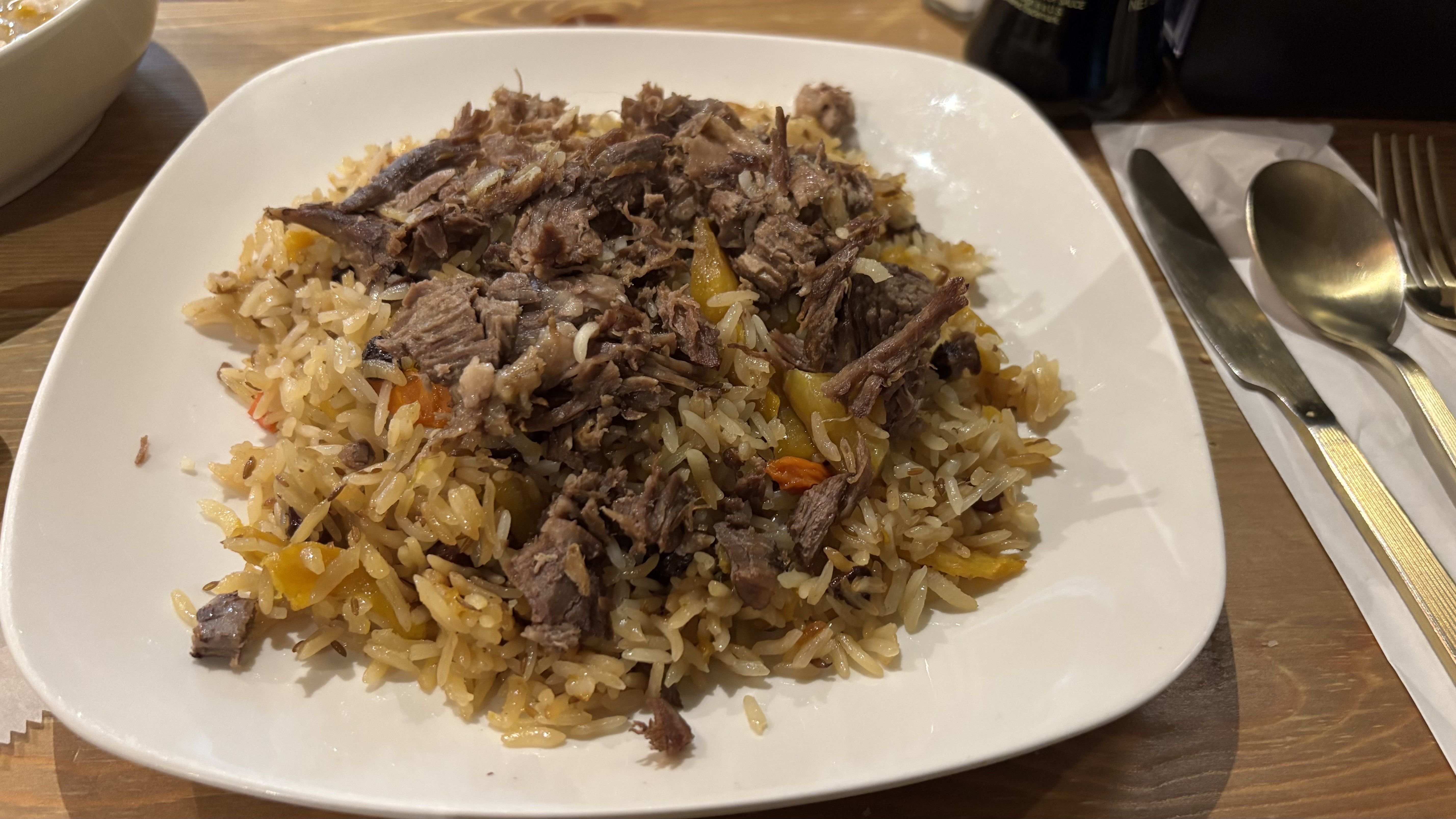 Plov, Uzbekistan's national dish of lamb over rice, sweet carrots and subtle spices that is slow-cooked to absorb all the juices