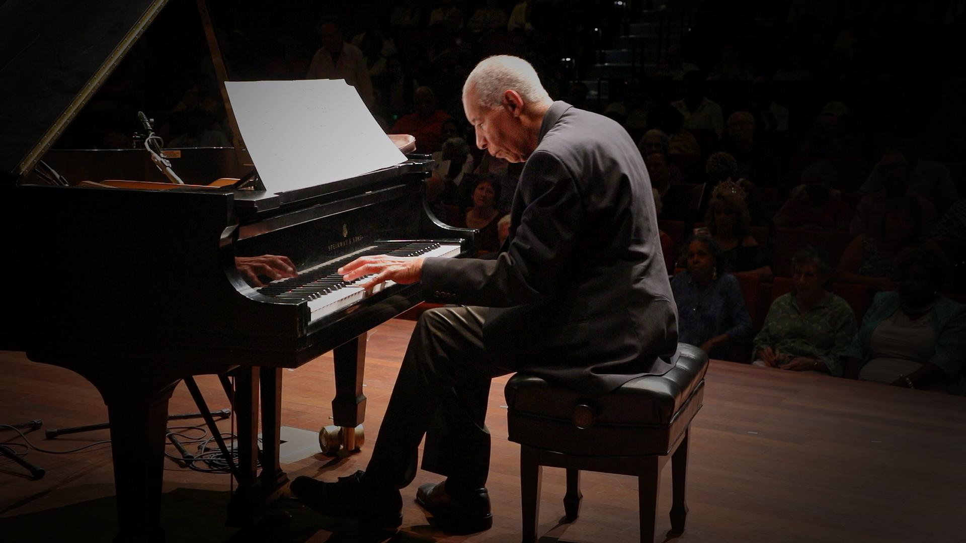 Photo of a man playing piano. 