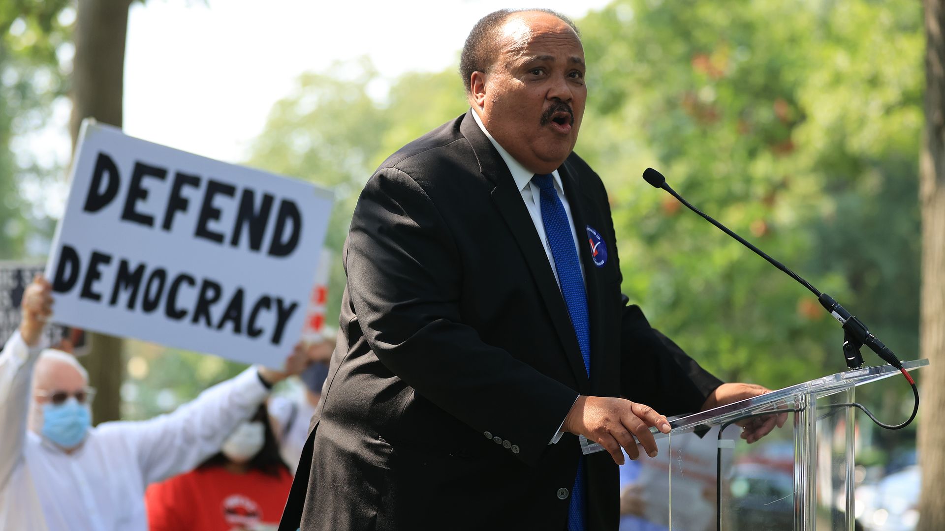 Martin Luther King III is seen speaking at a rally.