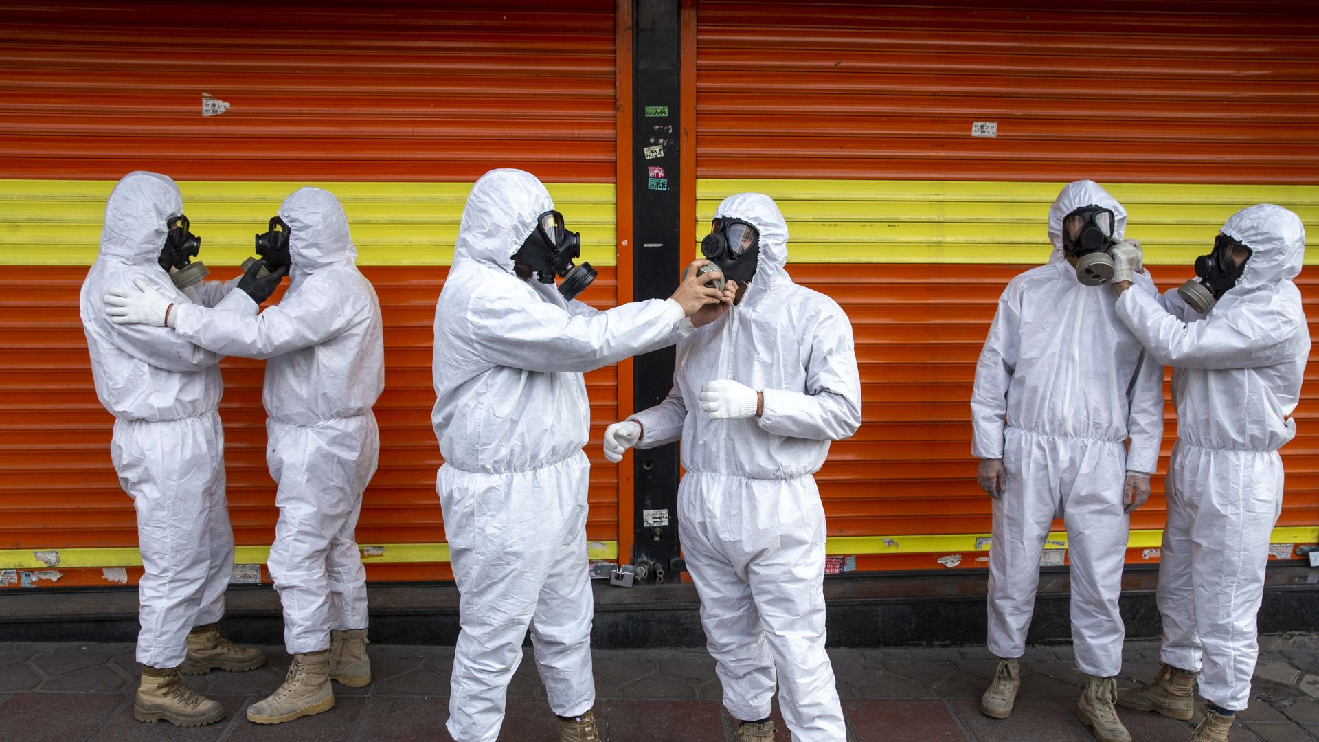 Revolutionary Guard members prepare to take part in disinfecting the city on March 25, 2020 in Tehran, Iran