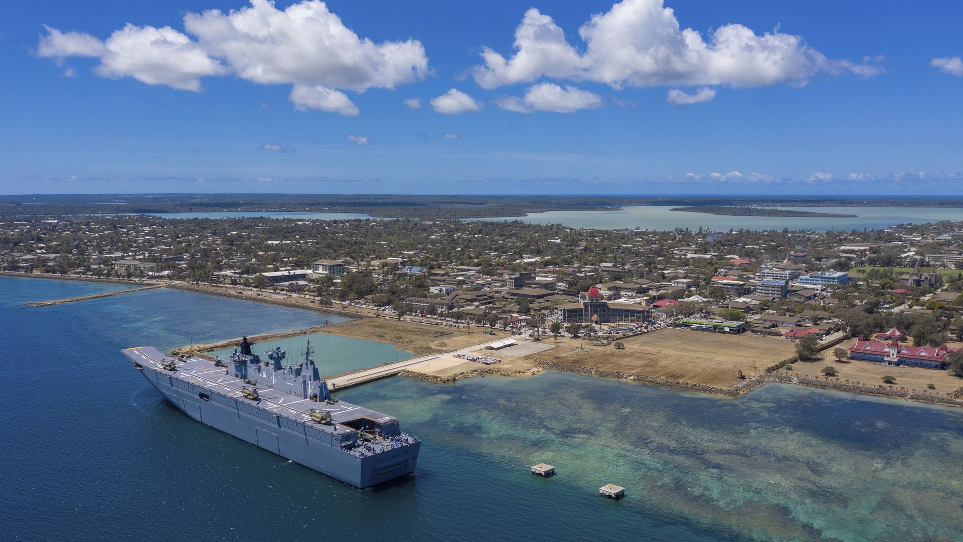 The HMAS Adelaide is docked at Nuku'alofa, Tonga, Thursday, Jan. 27, 2022, after carrying disaster relief and humanitarian aid supplies.