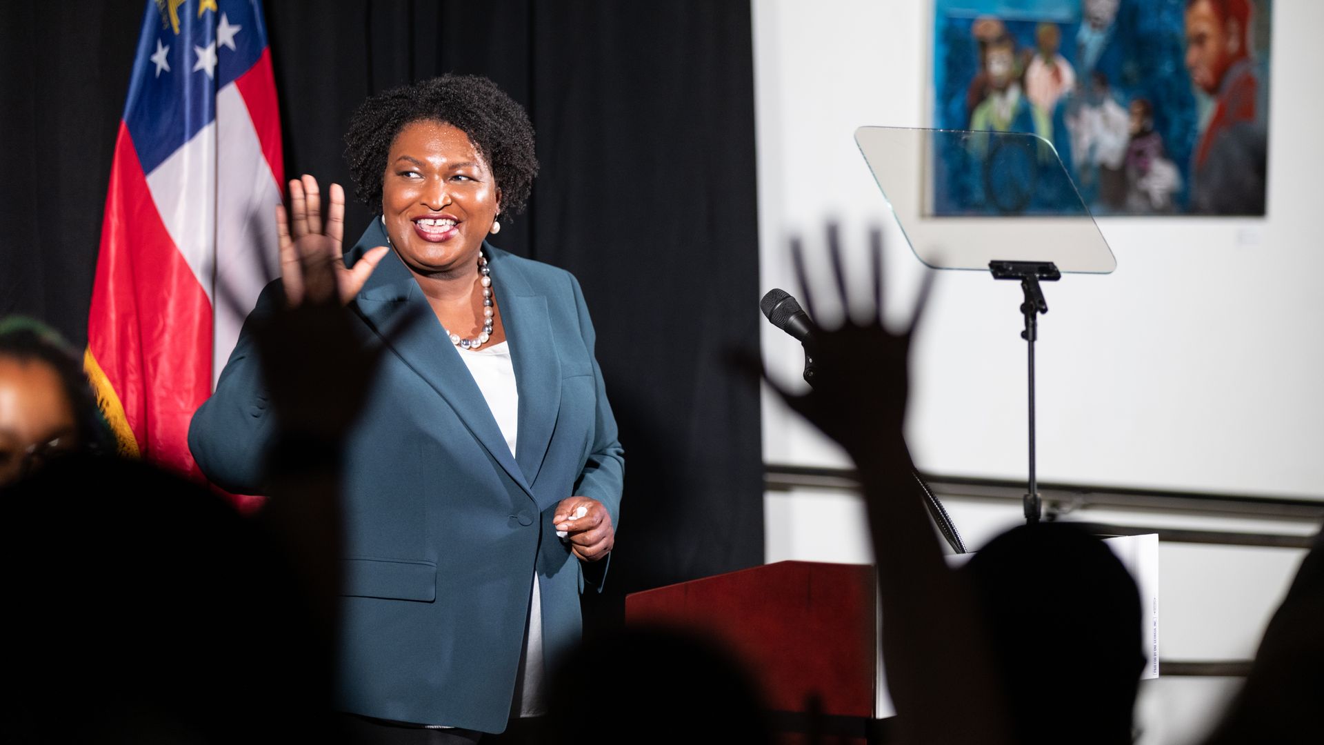 Stacey Abrams waves