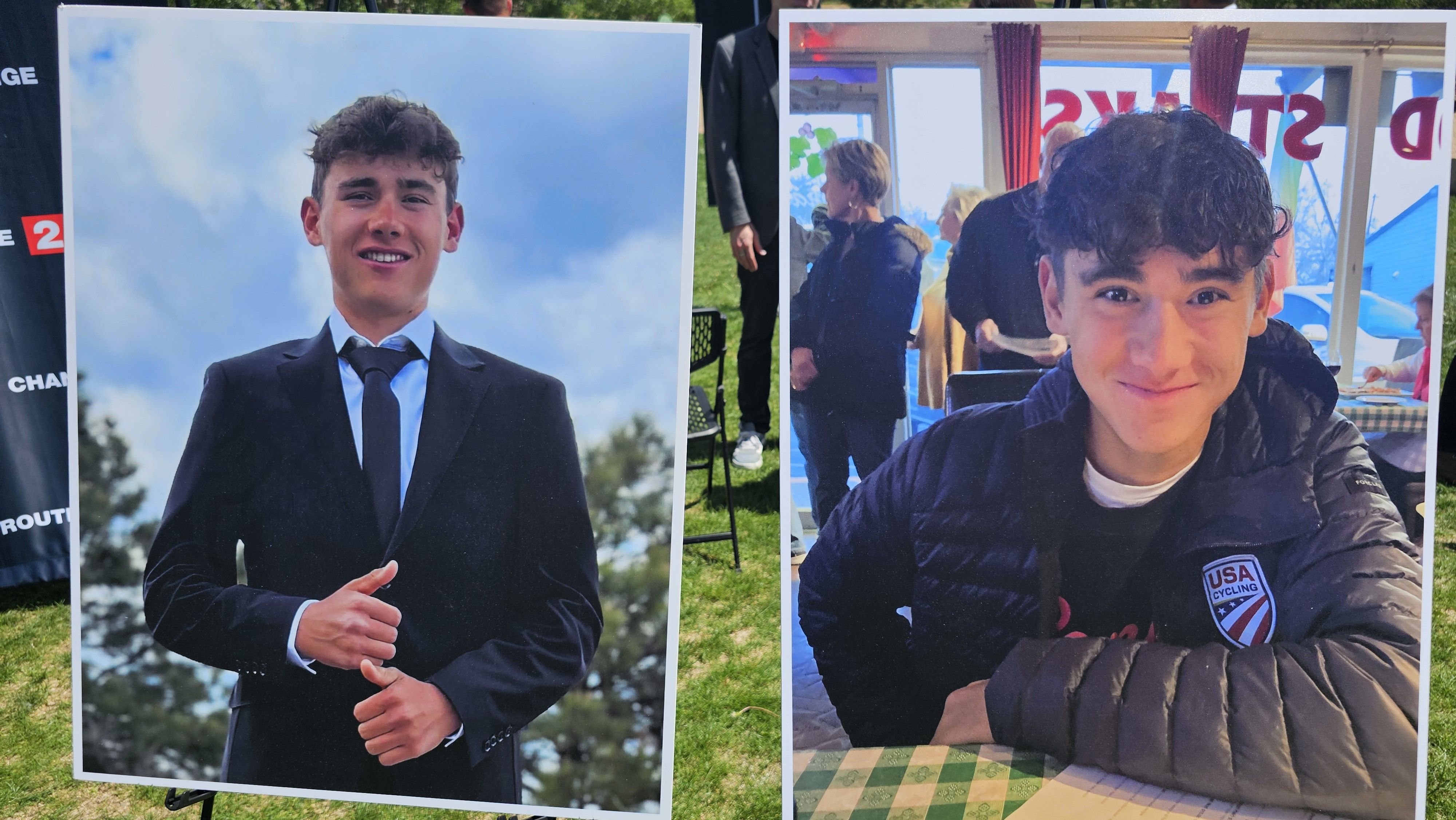 Two large portrait posters outdoors: left shows a young man in a suit against a blue sky; right shows a smiling young man in a dark jacket inside a room, with people and red curtains in background.