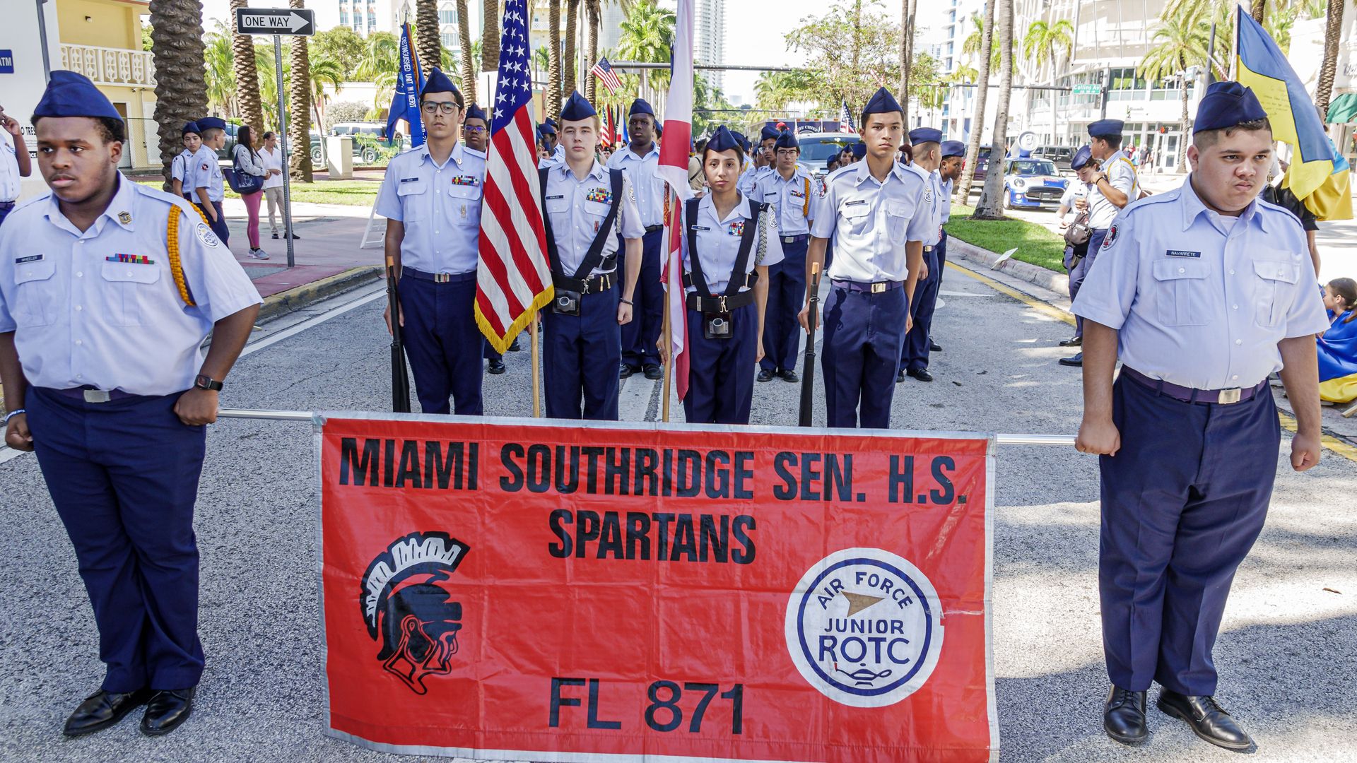 Southridge Senior High School Air Force ROTC cadets in Miami holding banner during Veterans Day Parade.