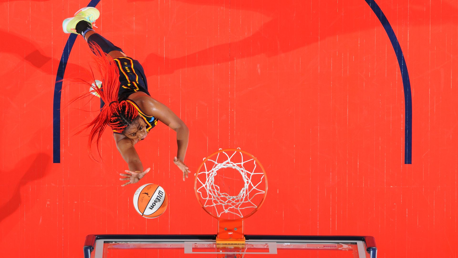 Indiana Fever forward Aliyah Boston goes for a layup with no defenders nearby.
