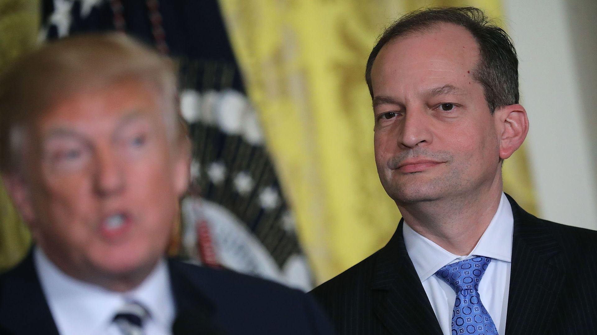 In this image, Acosta stands behind Trump.