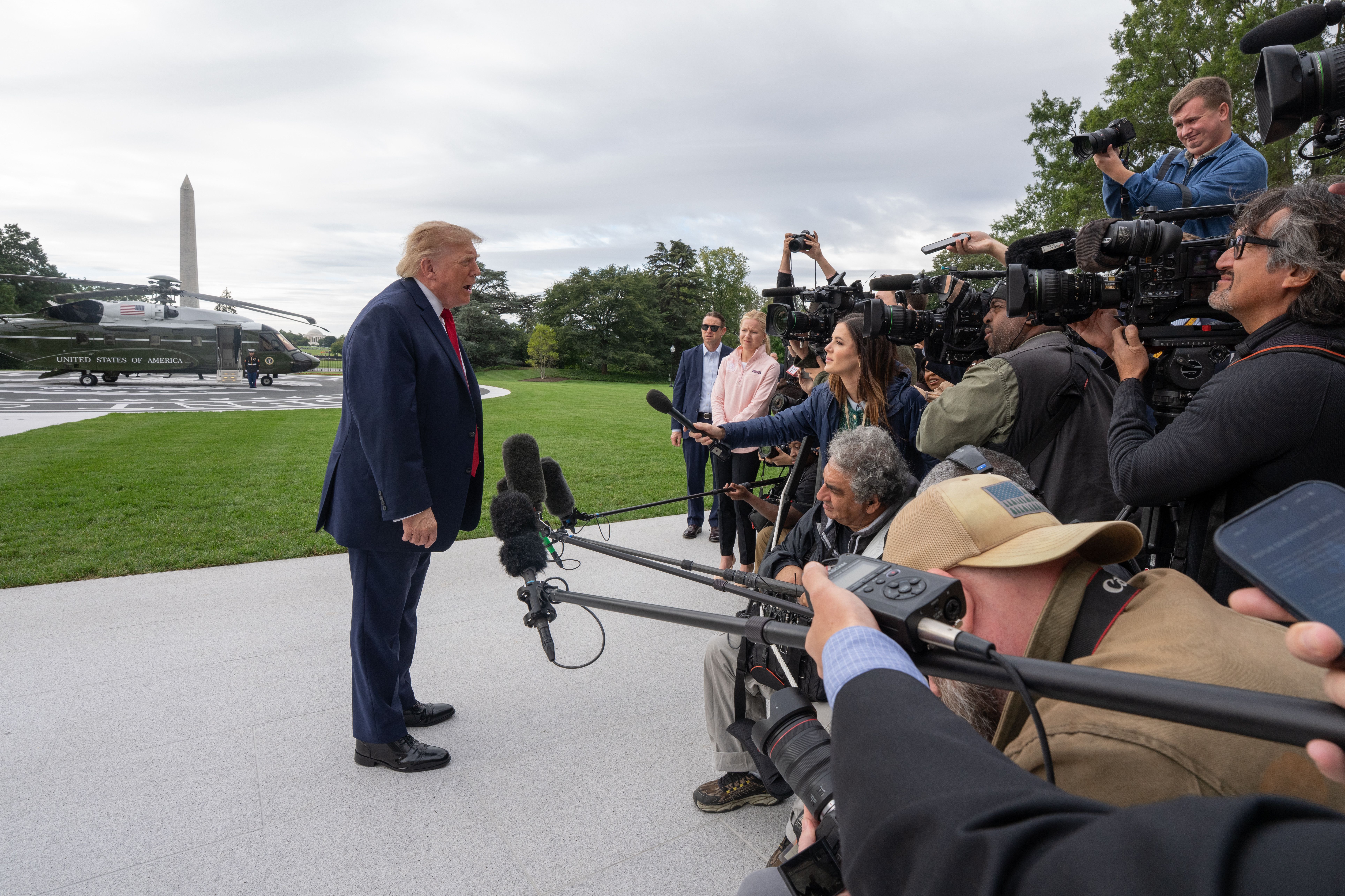 Trump speaks with reporters