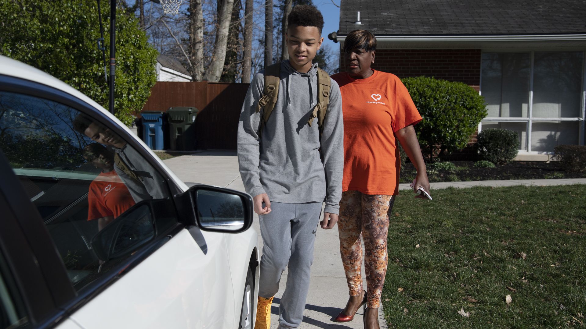 Jalen Walker heads to football practice using service from the company HopSkipDrive with driver Jacqueline Bouknight in Springfield, Virginia 