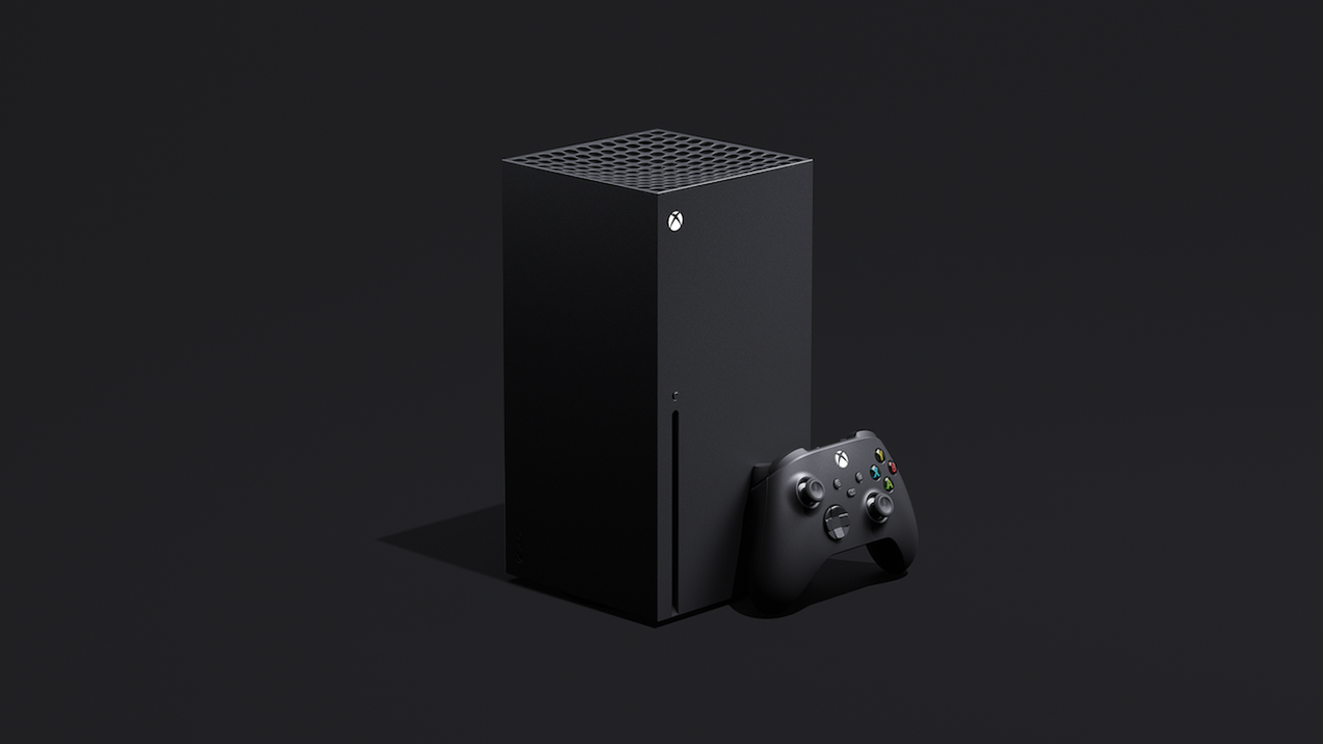 Image of a black Xbox console and controller in front of a black background