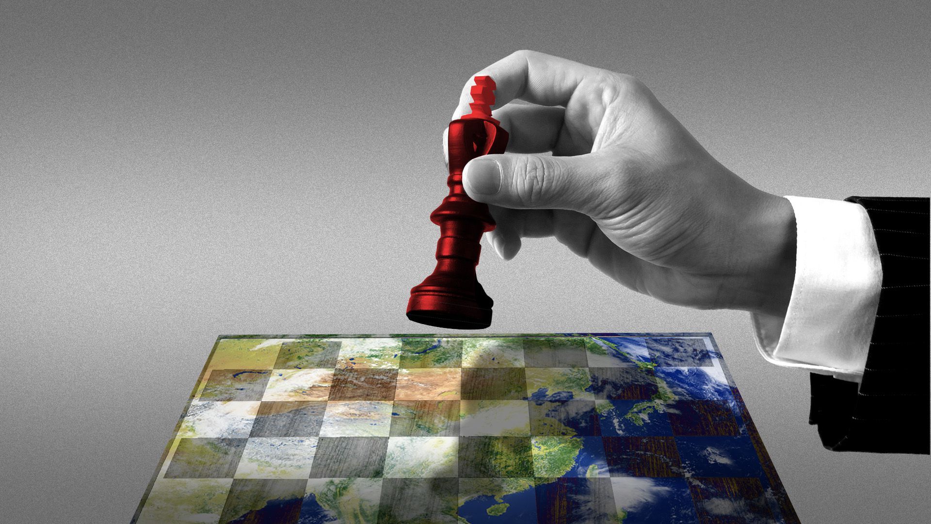 Illustration of a hand holding a chess piece over a world-shaped chessboard