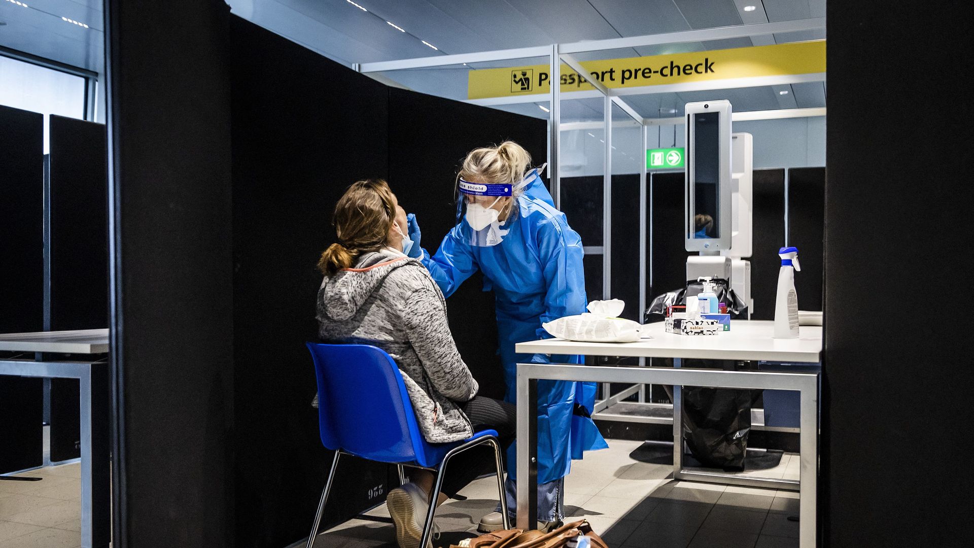 Travelers from South Africa are tested for the coronavirus on arrival in a specially designed test street at Schiphol airport,