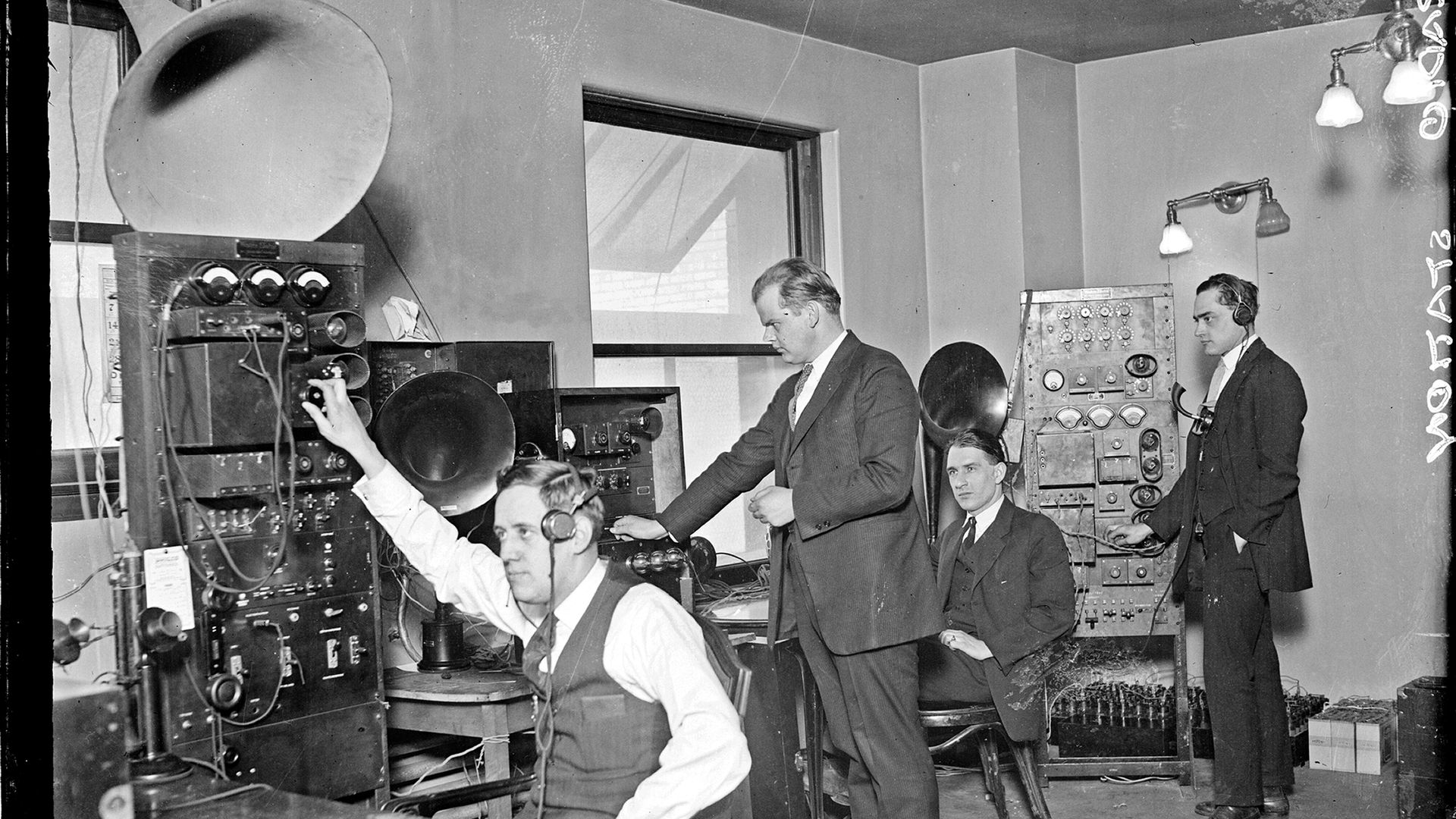Radio operators in old fashioned control room 