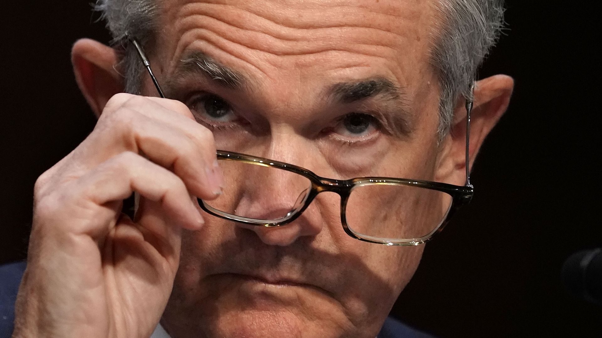 Federal Reserve Chair Jerome Powell peers over his glasses