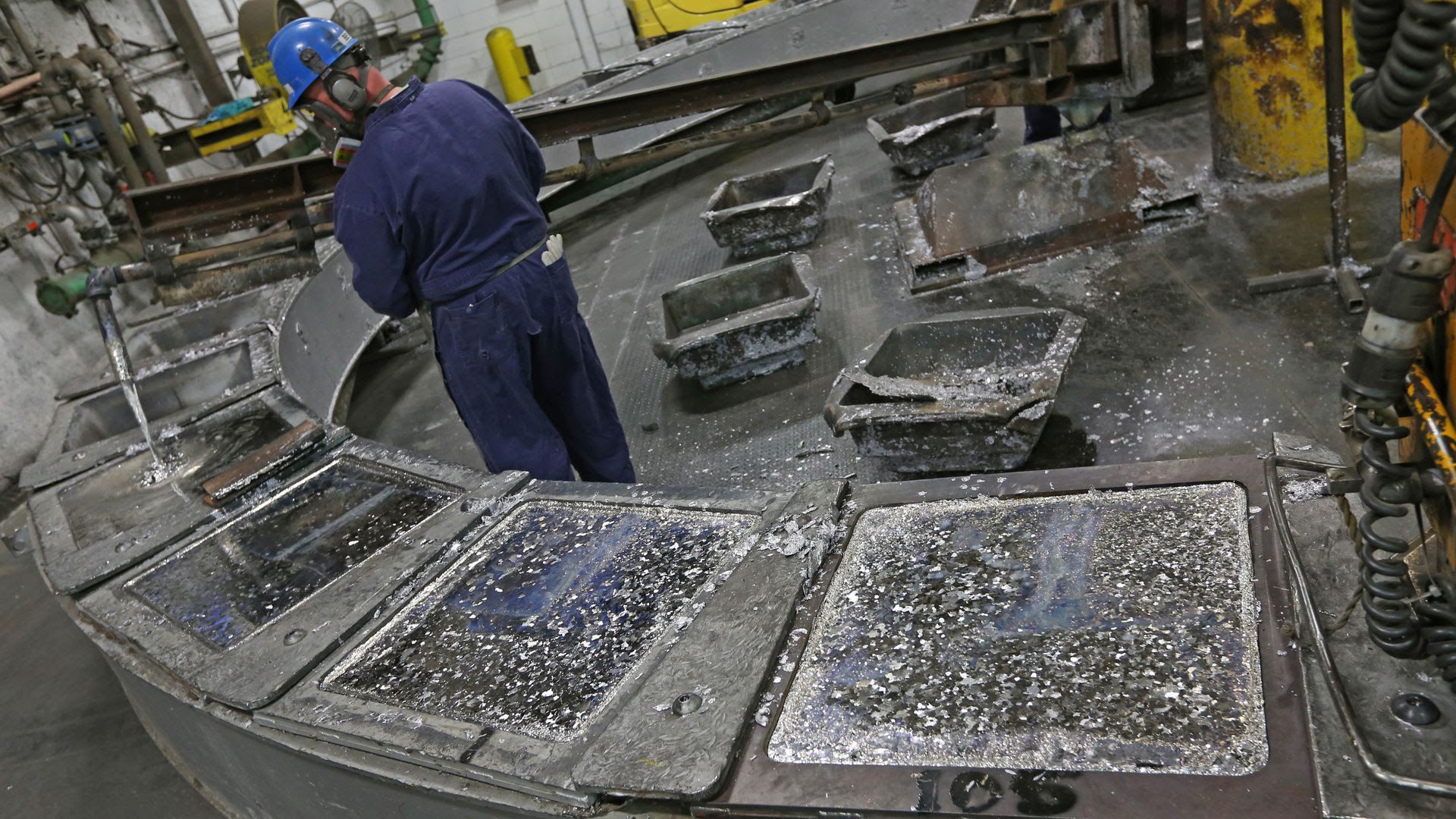 Gopher Resource employee pours melted lead from recycled batteries into ingots for reuse at a Gopher Resource plant. 