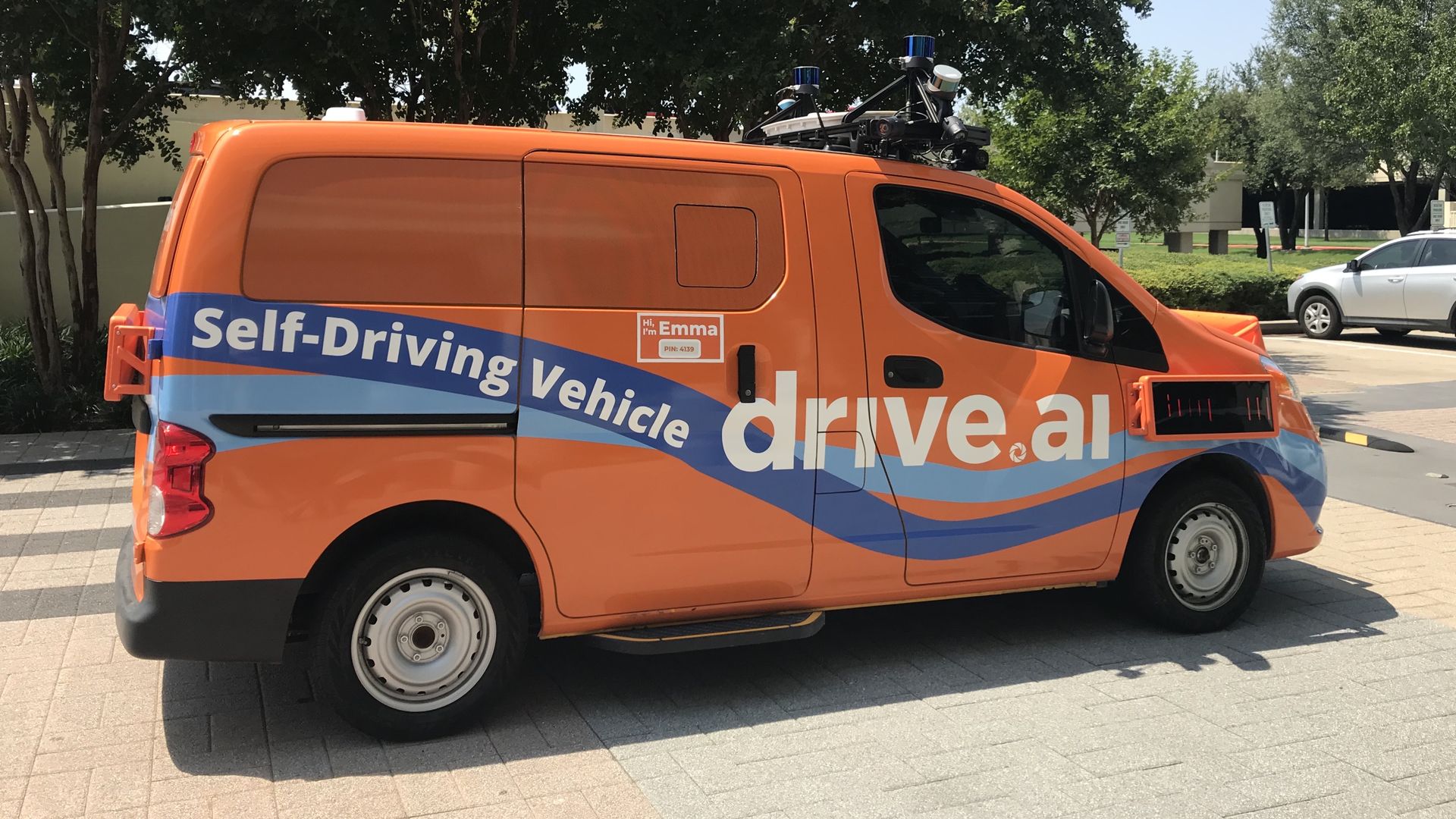 Photo of an orange self-driving van