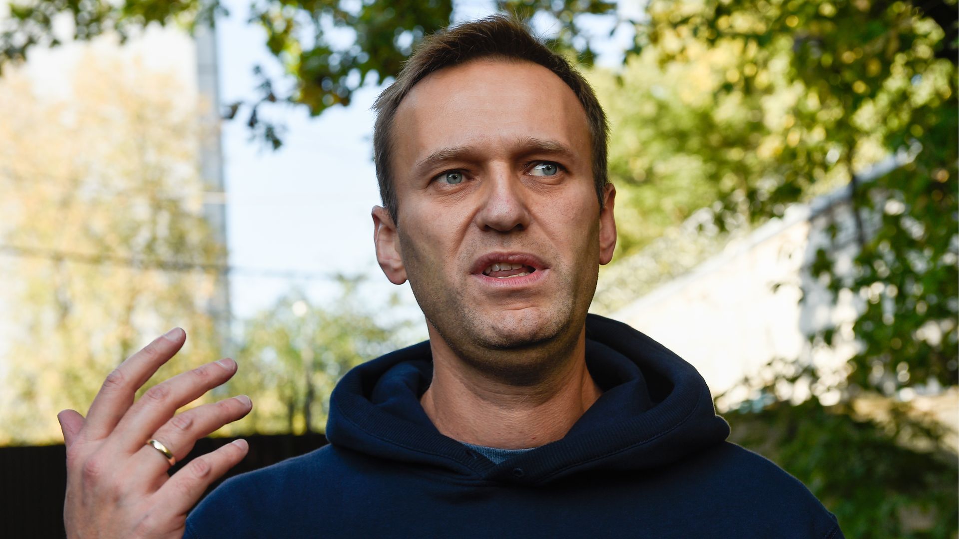 Opposition activist Alexei Navalny talks to the media after being released from 30 days of detention