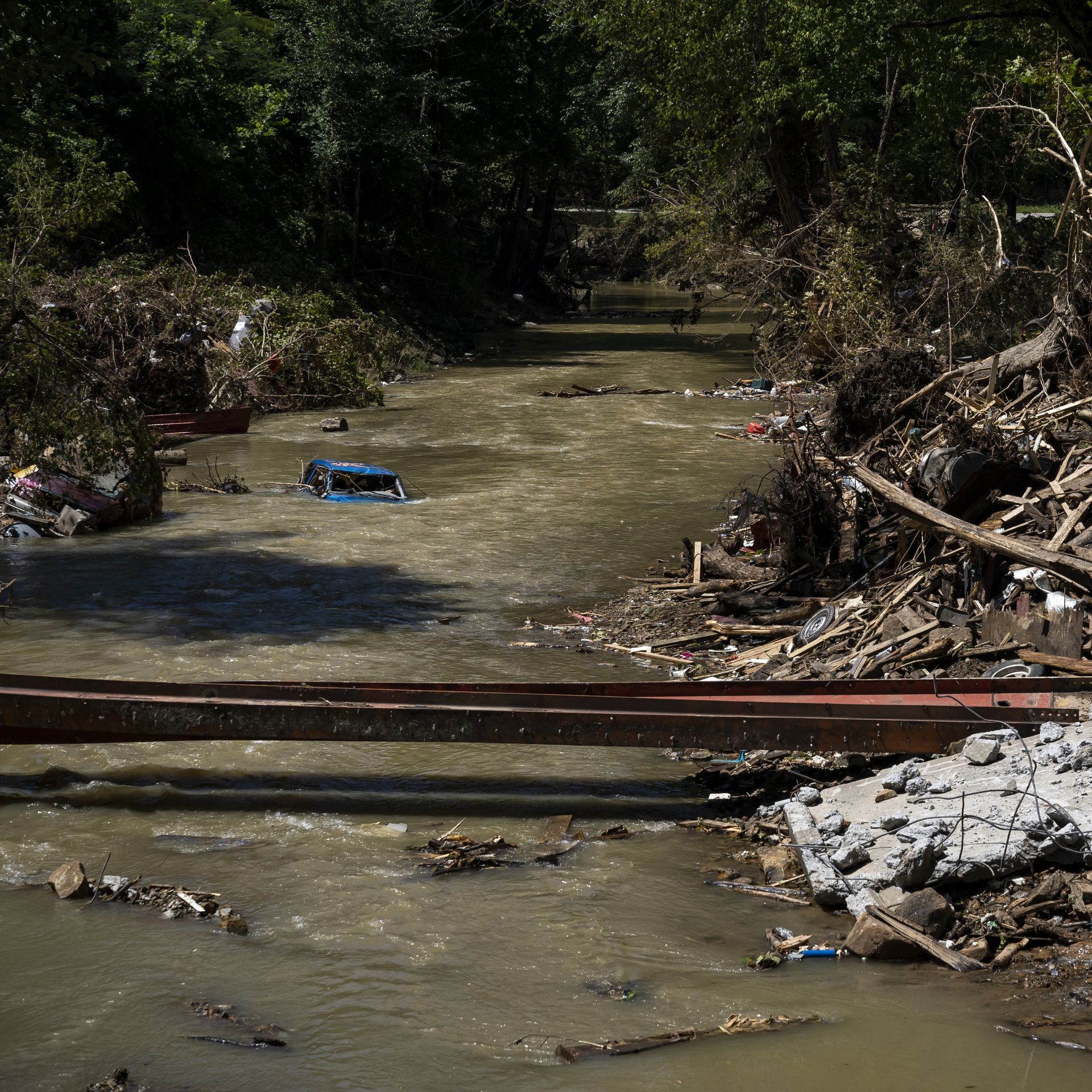  A car is still partially submerged in Troublesome Creek in Perry County, Kentucky near Hazard on August 6.