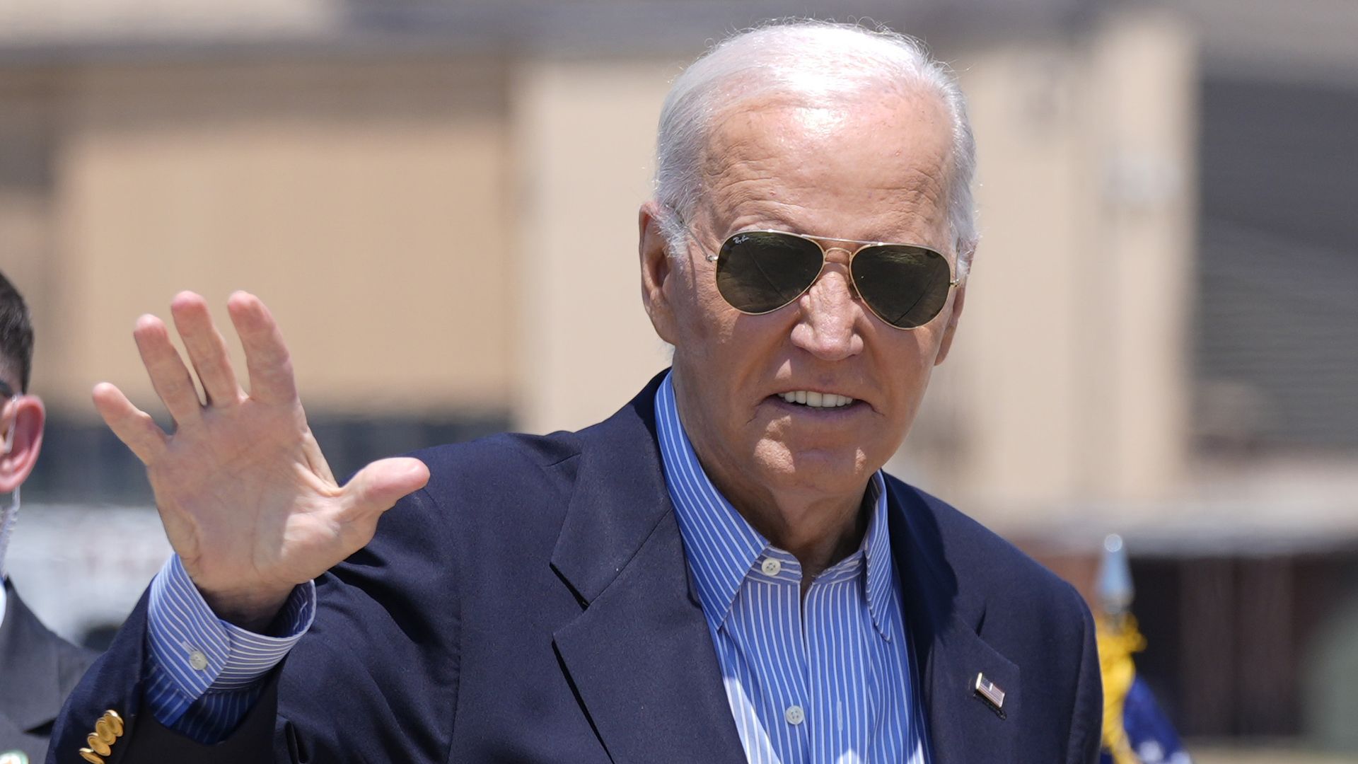 President Joe Biden waves as he arrives to board Air Force One at Andrews Air Force Base, Md., en route to a campaign trip in Madison, Wis.