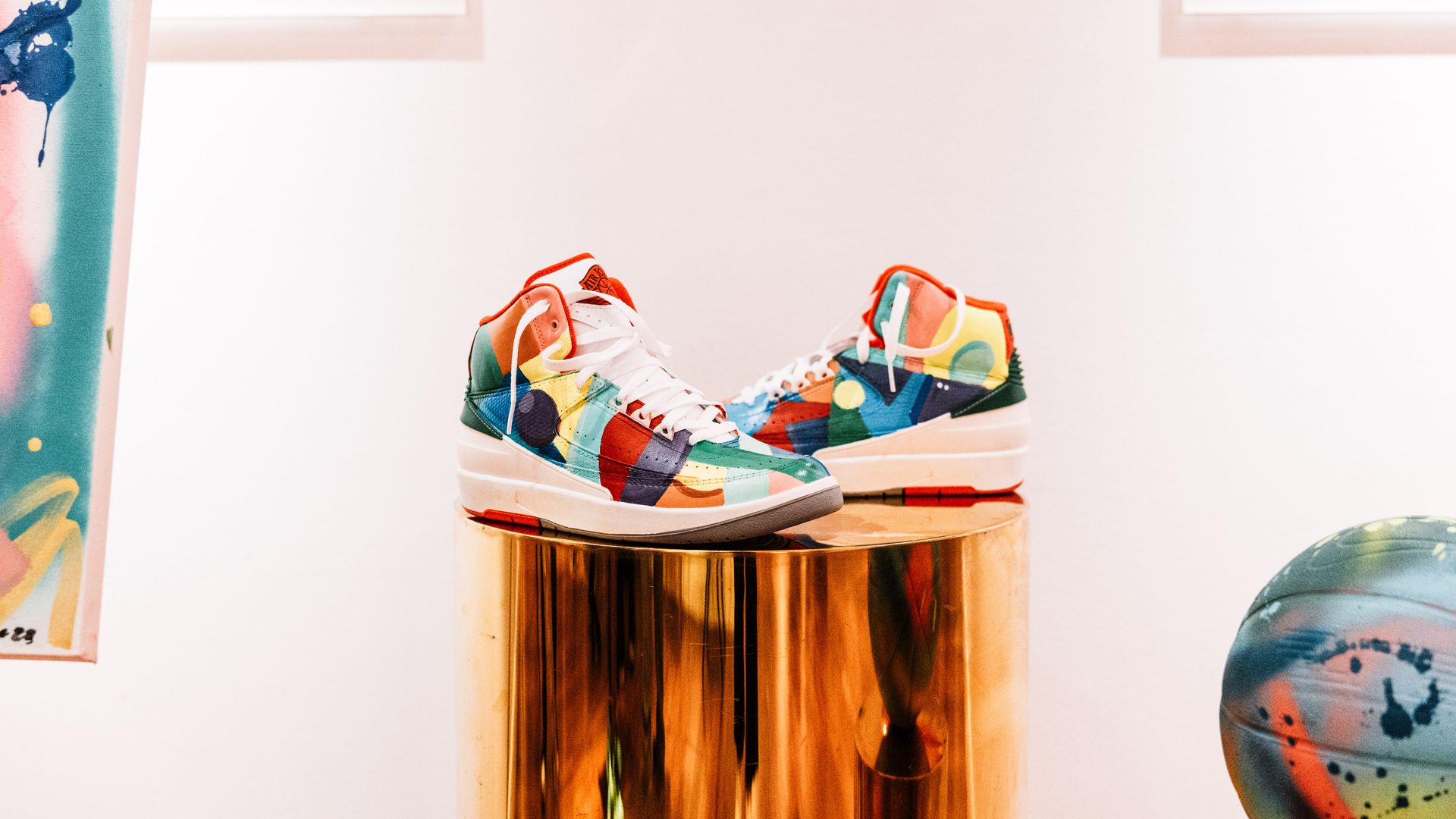 Decorated basketball shoes at an art exhibit for the Jumpman Invitational. 