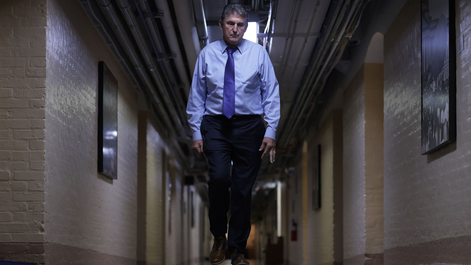 Sen. Joe Manchin is seen walking through the Capitol basement.