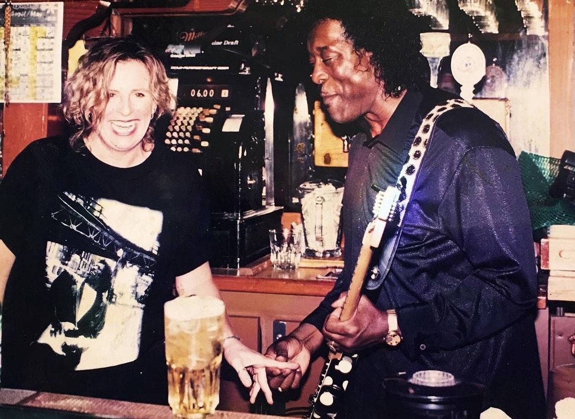 Buddy Guy plays guitar.