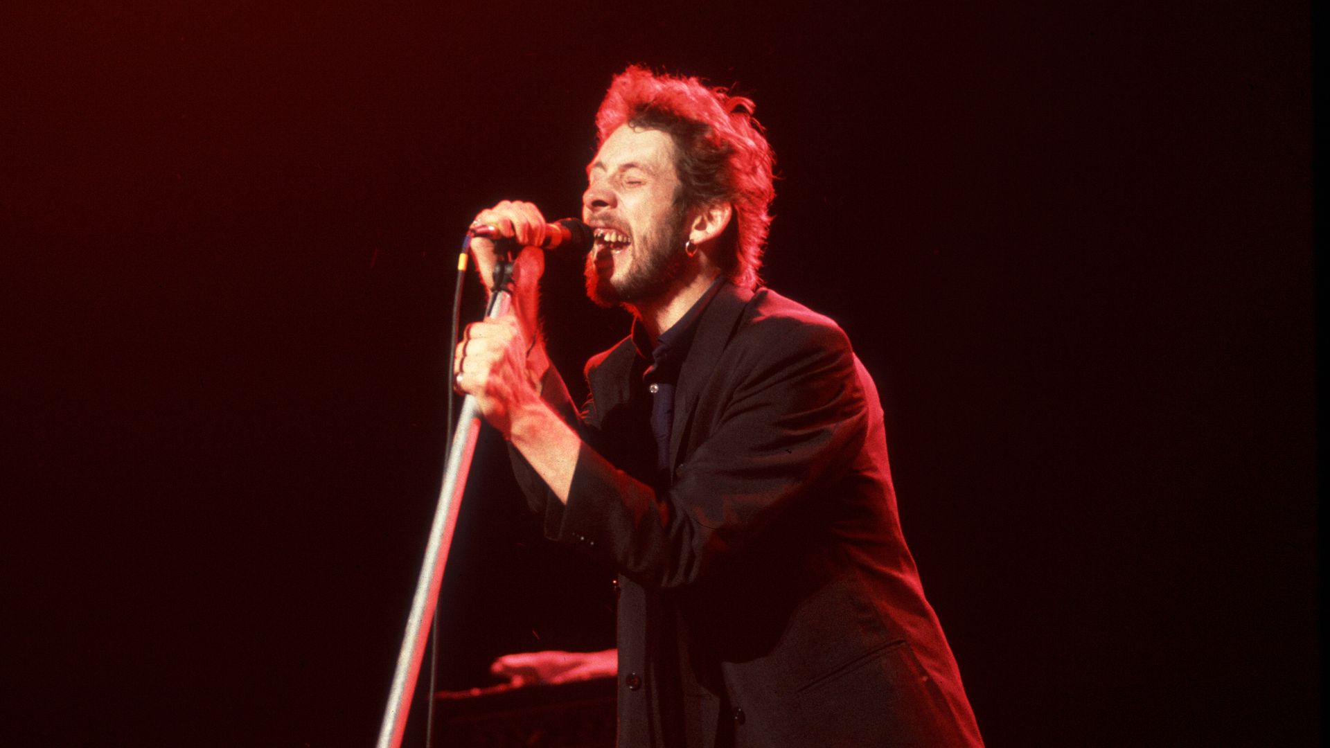 guy singing in a microphone