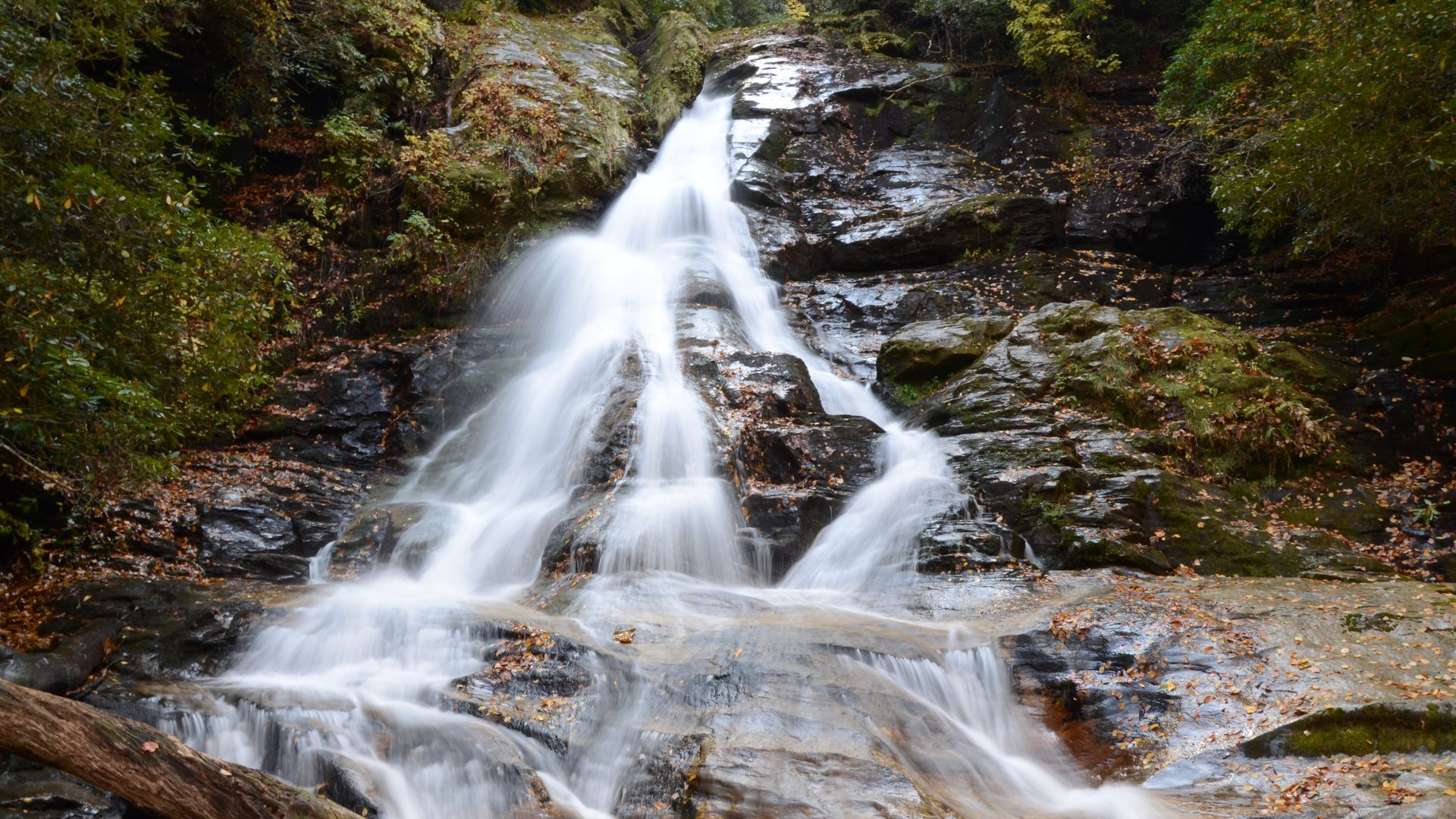 A long-exposure shot of water hitting and gliding over rocks at a waterfall at High Shoals Falls