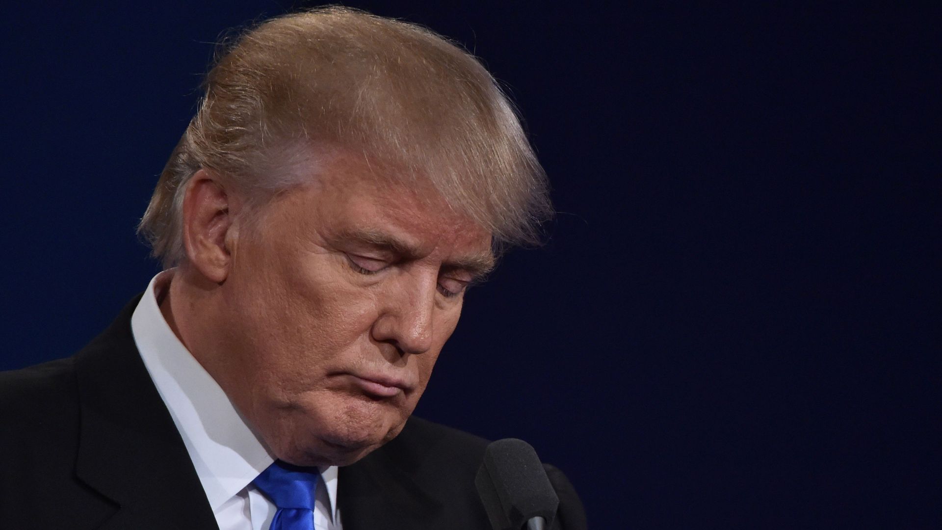 Donald Trump looking sad with his face down