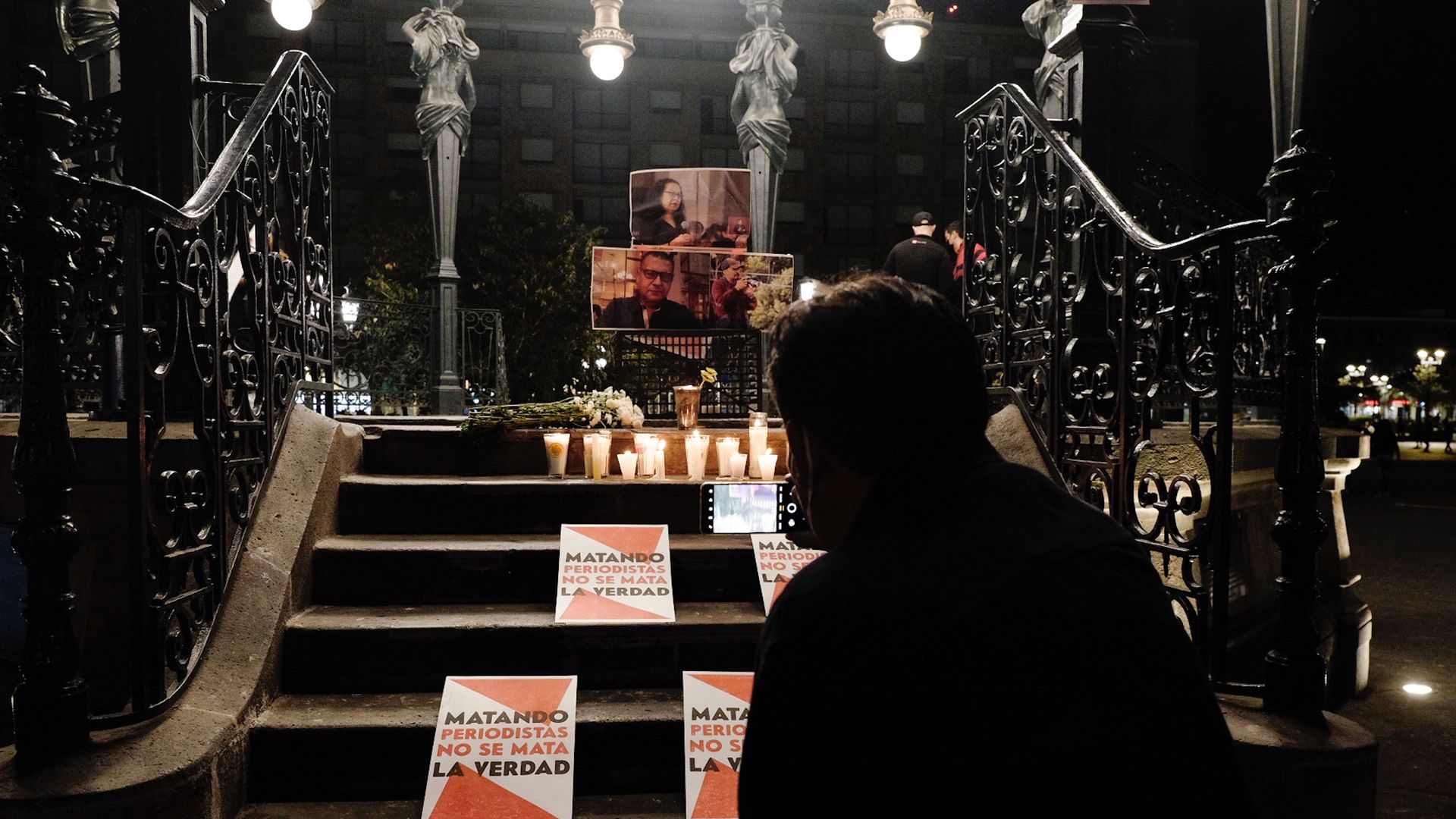  A journalist takes a photo during a protest to ask for justice for journalists and photojournalists murdered in Mexico on January 25, 2022 in Guadalajara, Mexico.