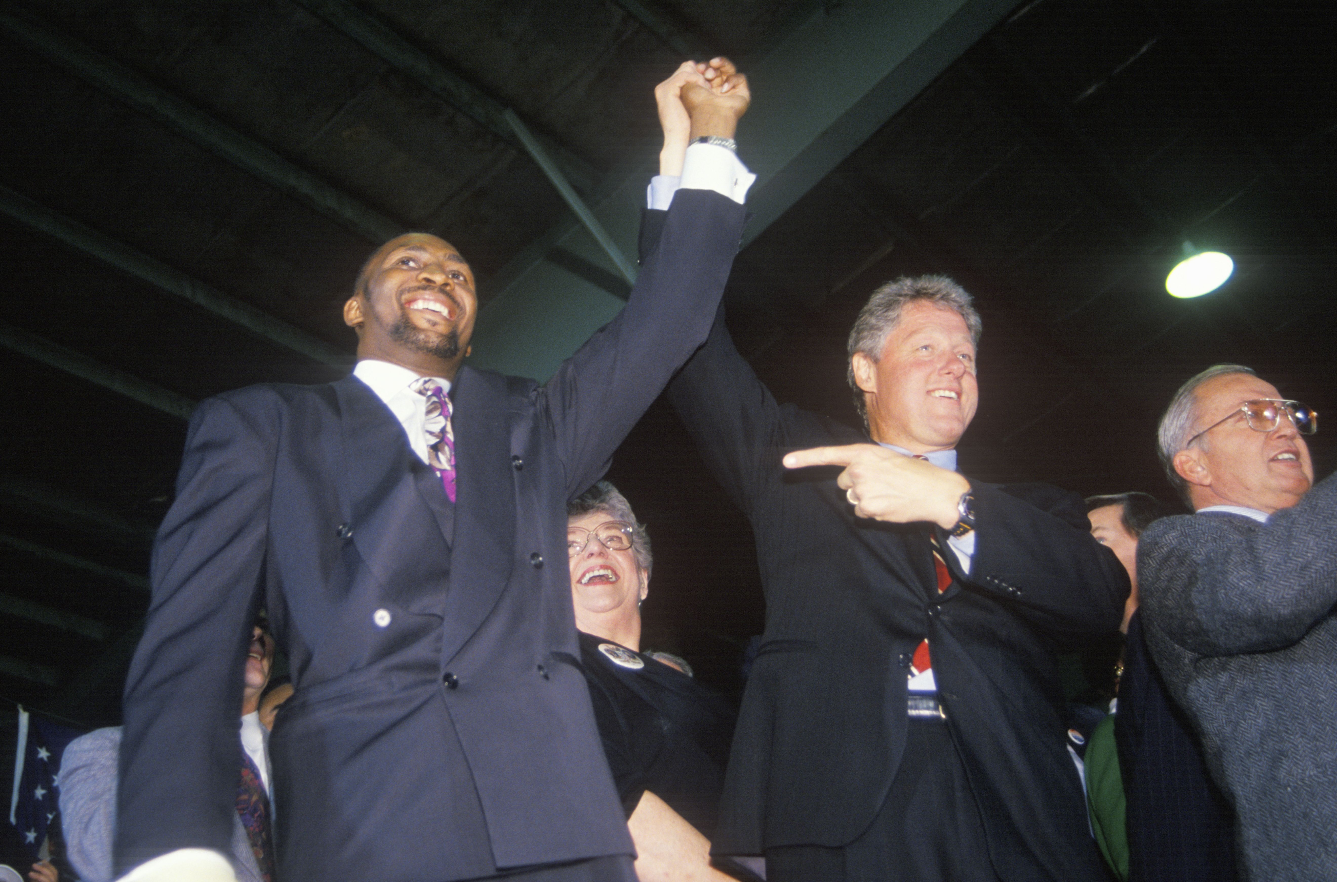 Governor Bill Clinton joins hands with Boxer Tommy Heams during a Detroit campaign rally in 1992 on his final day of campaigning in Detroit, Michigan (Photo by: Joe Sohm/Visions of America/Universal Images Group via Getty Images)