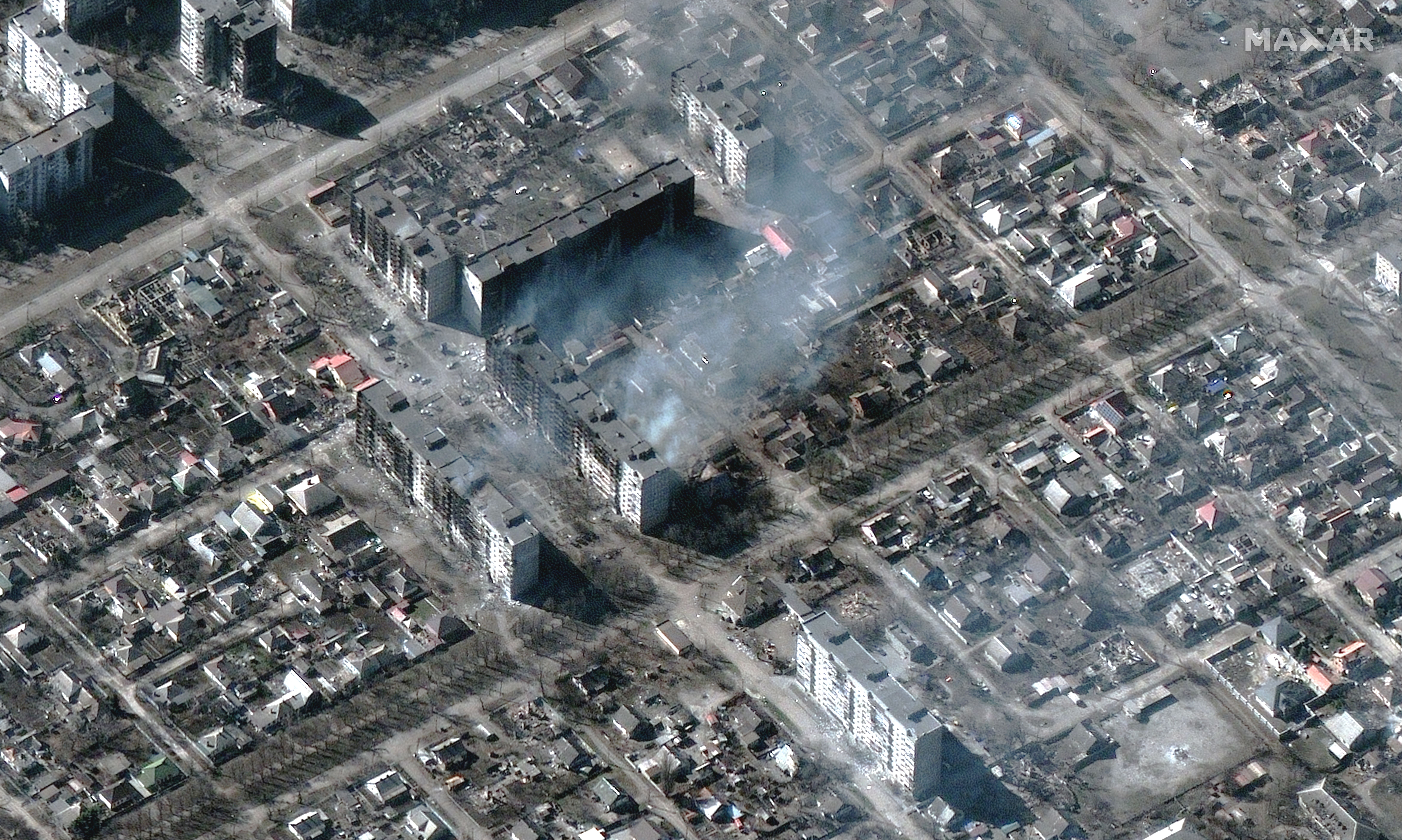 burning and destroyed apartment buildings in Mariupol, Ukraine on March 22.