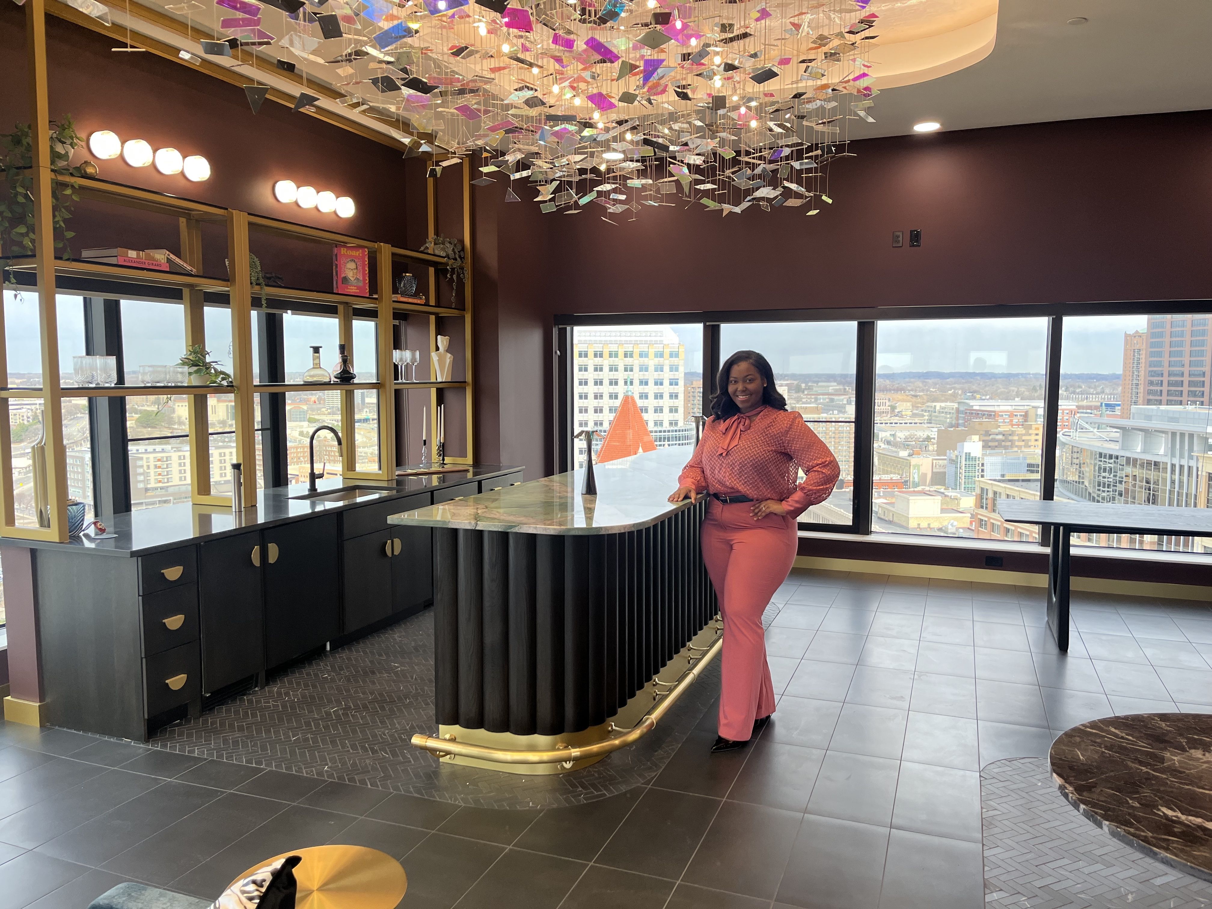 A photo of a woman standing at the bar of the lounge