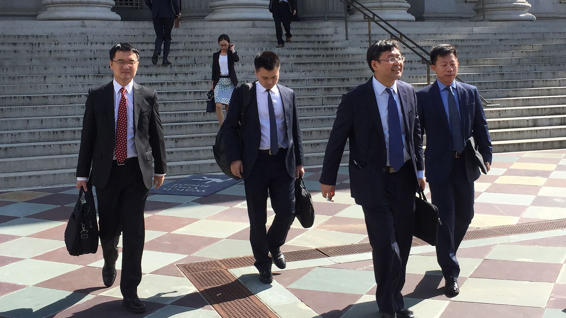 Photo of members of China trade delegation leaving unsuccessful meeting in D.C.