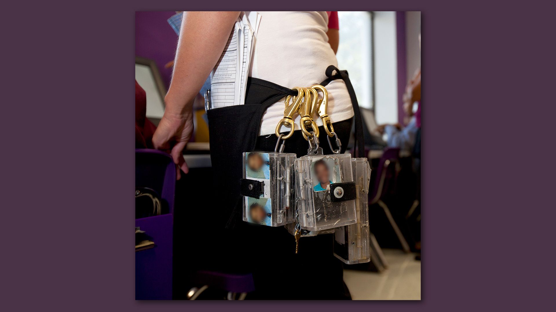 Photo of a teacher with a belt containing electric shock remote control devices