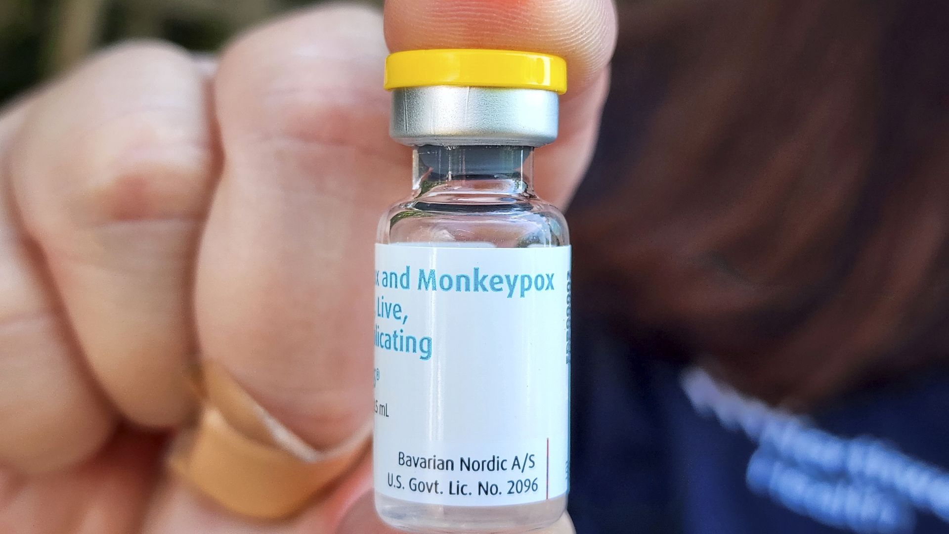 Monkeypox vaccine is displayed by a medical professional.
