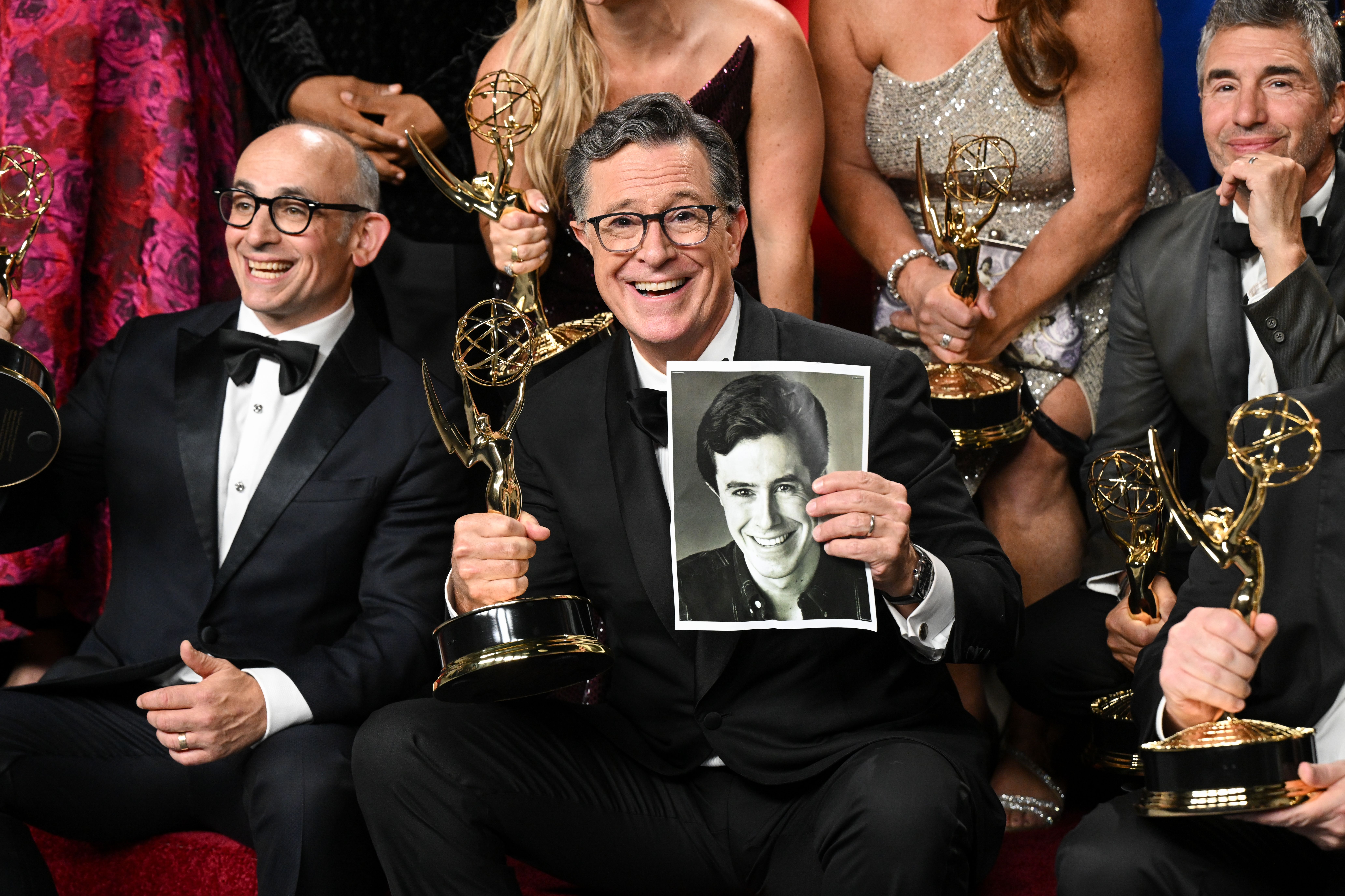 Stephen Colbert and additional cast and crew pose with the Outstanding Talk Series award for "The Late Show With Stephen Colbert" at the 77th Primetime Emmy Awards held at the Peacock Theater on September 14, 2025 in Los Angeles, California. (Photo by Gilbert Flores/Variety via Getty Images)