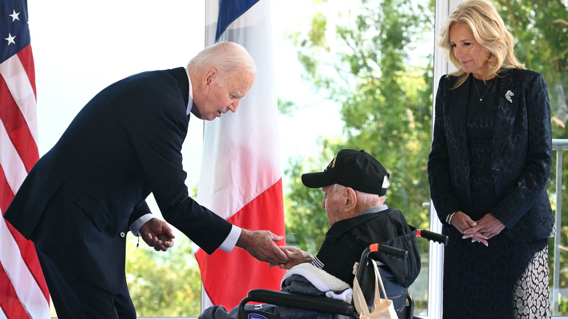 President Biden shaking the hand of a U.S. World War II veteran at the Normandy American Cemetery and Memorial in Colleville-sur-Mer, France, on May 6.