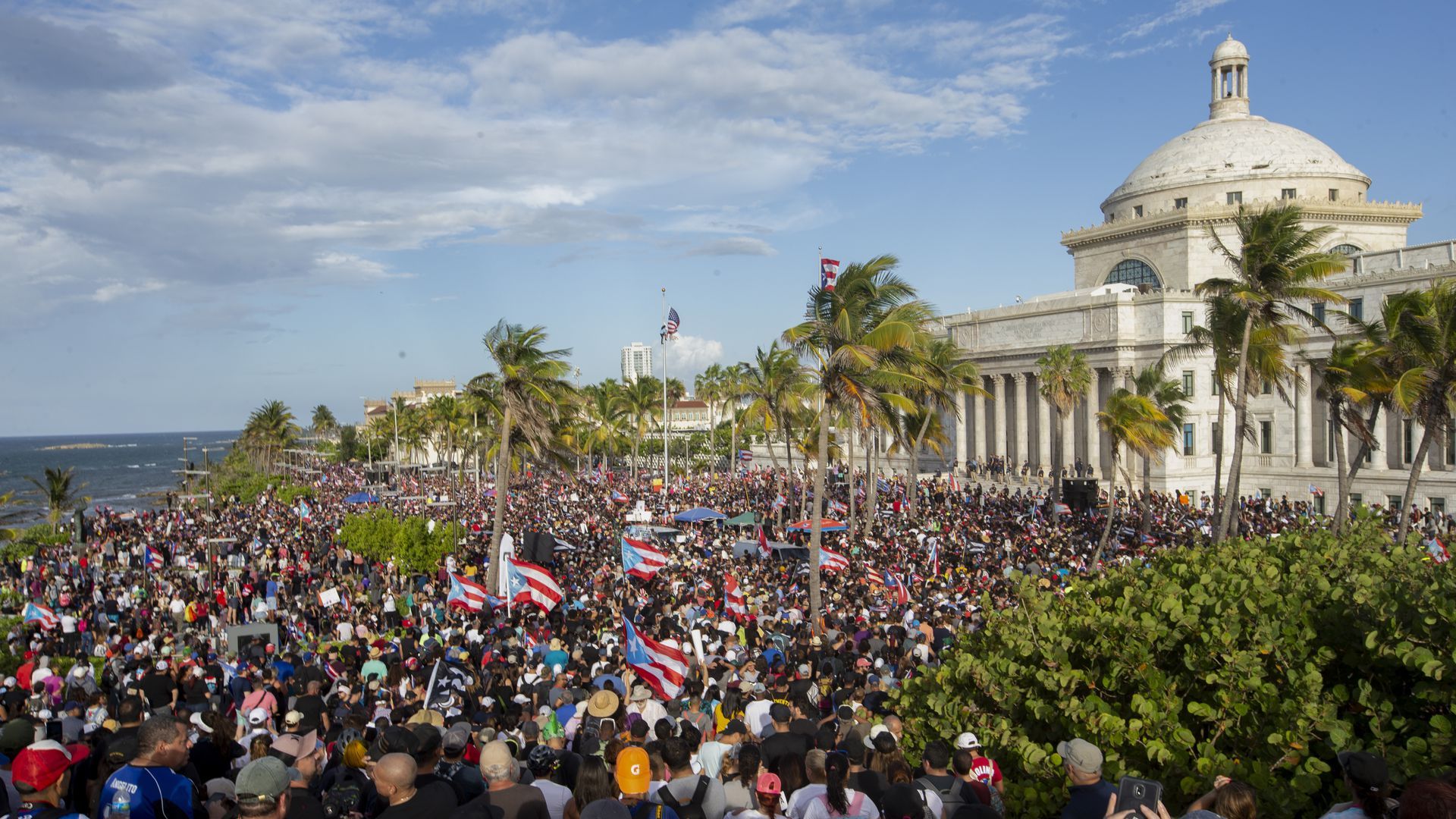 Demonstrators protest in front of the Capitol Building in Old San Juan, Puerto Rico. 