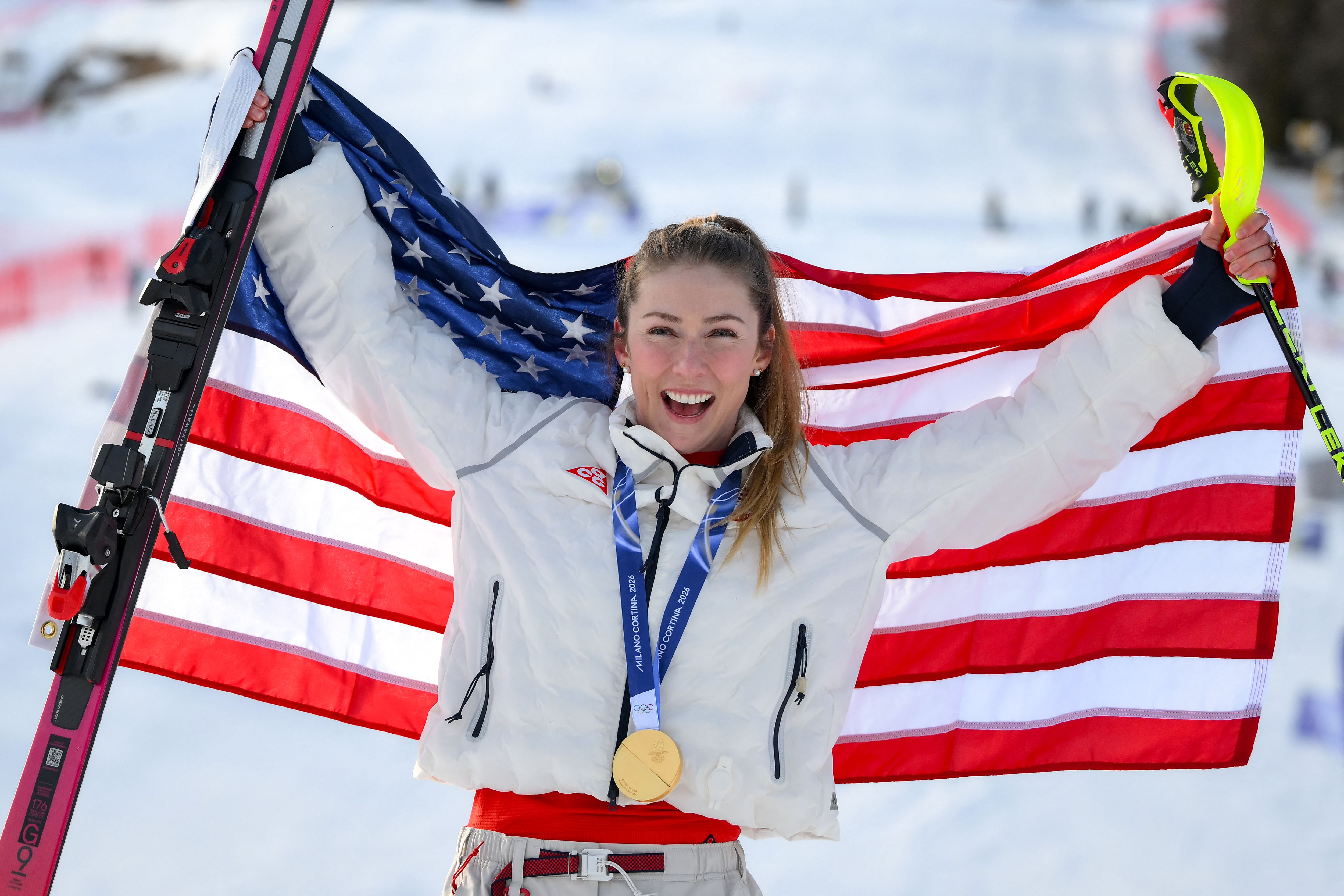 USA's gold medallist Mikaela Shiffrin celebrates during the podium ceremony of the women's slalom event during the Milano Cortina 2026 Winter Olympic Games at the Tofane Alpine Skiing Centre in Cortina d'Ampezzo on February 18, 2026. (Photo by Marco BERTORELLO / AFP via Getty Images)