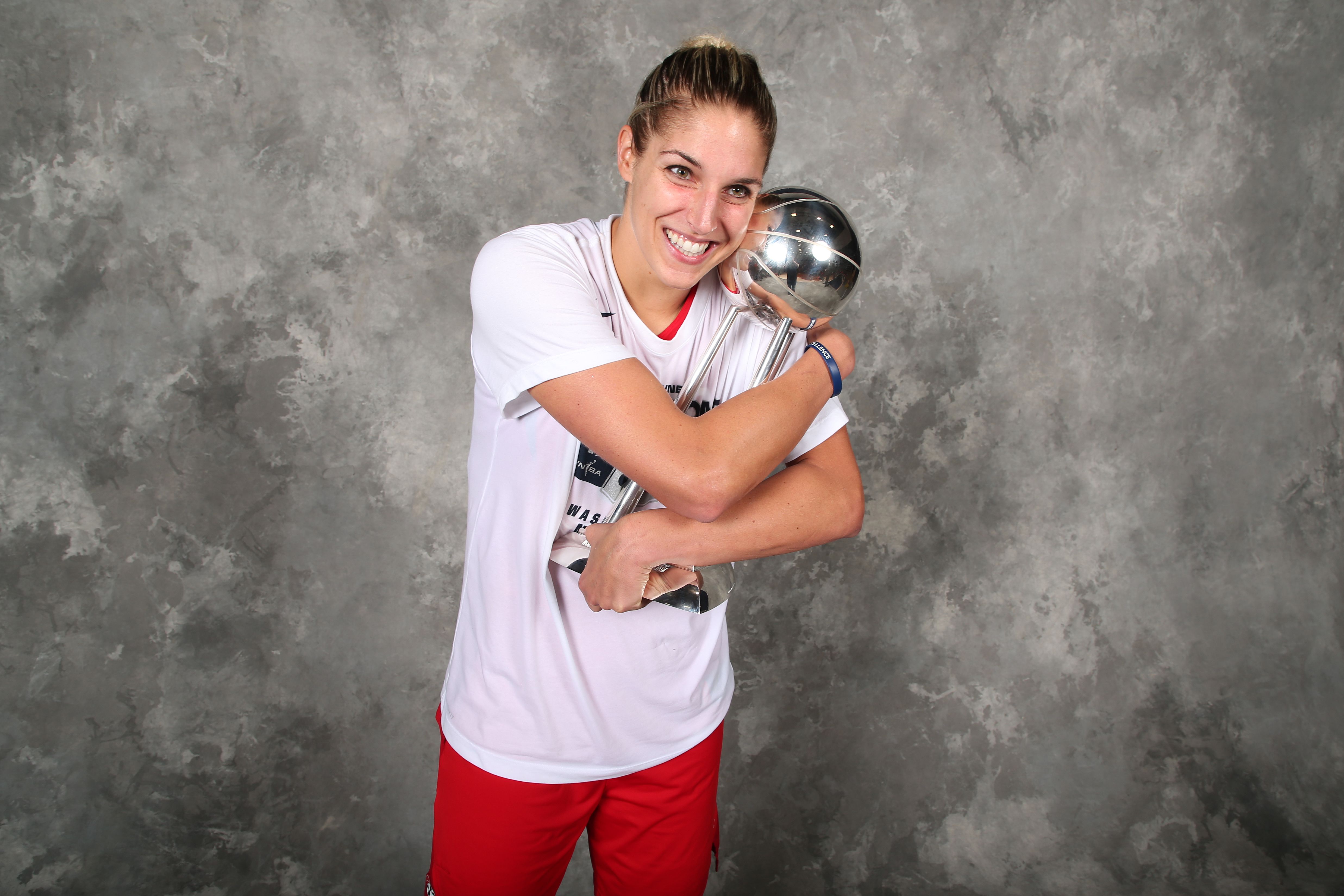 Elena Delle Donne hugs the WNBA Championship Trophy.