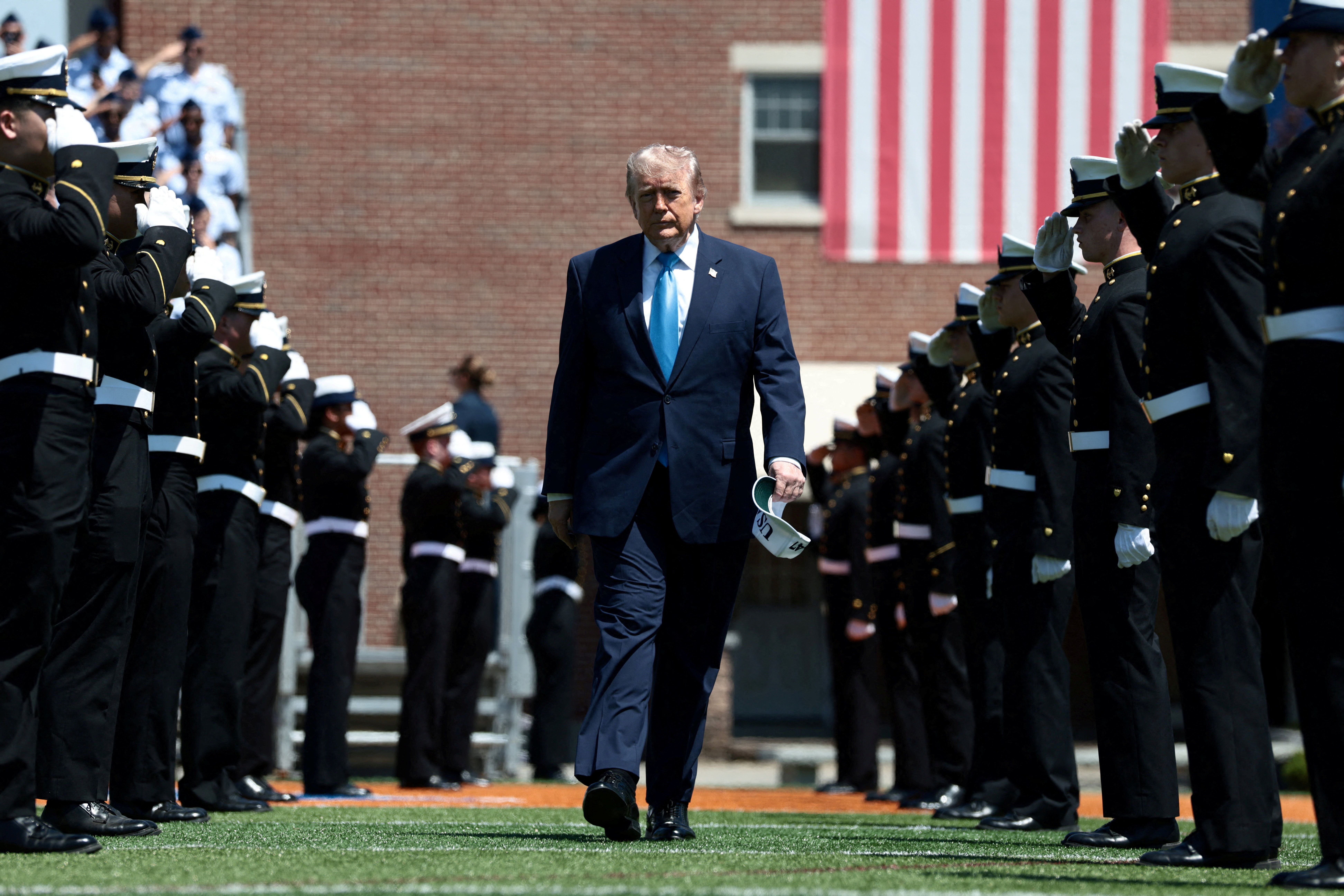 President Trump arrives to deliver the commencement address at the United States Coast Guard Academy in New London, Conn., yesterday.