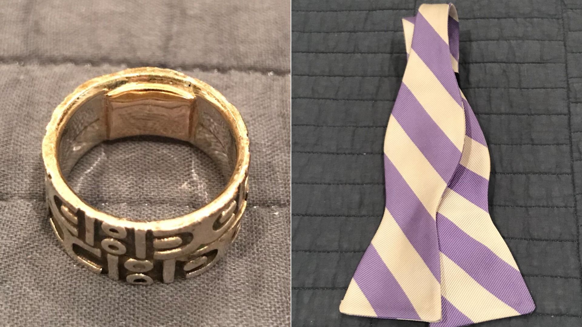 A gold wedding band with inscription and a purple and white bow tie.