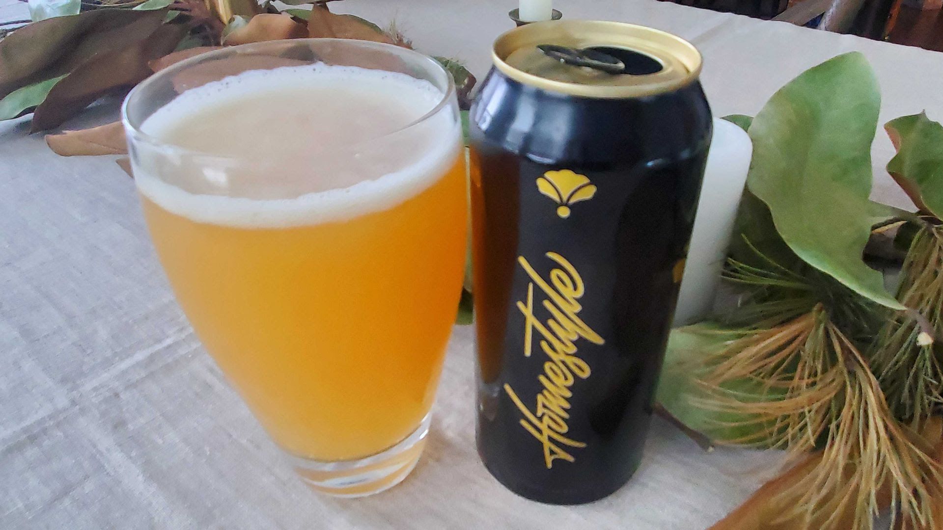 The Bearded Iris Homestyle IPA in a glass next to its can.